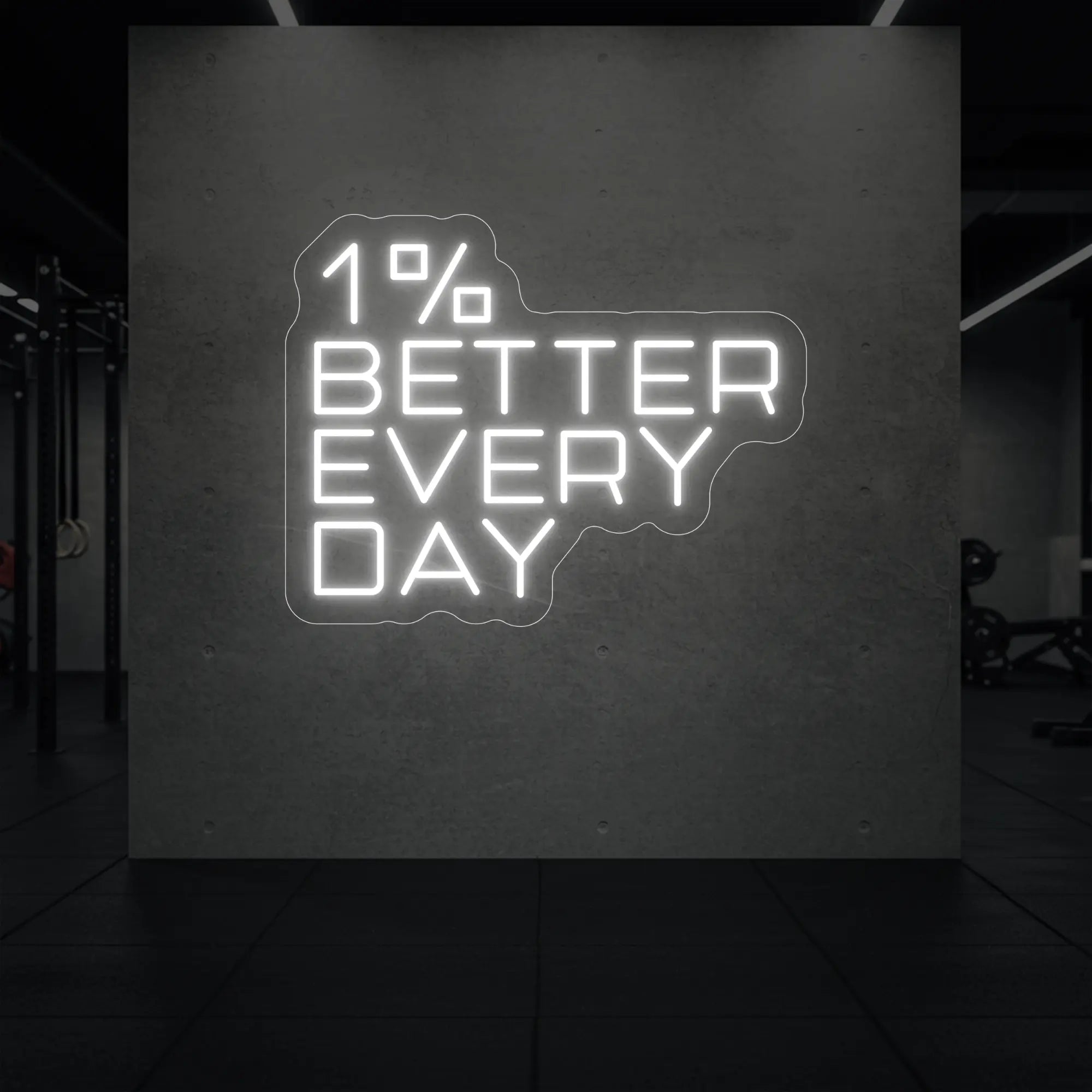 '1% Better Every Day' neon sign glowing in cool white against a styled interior wall.