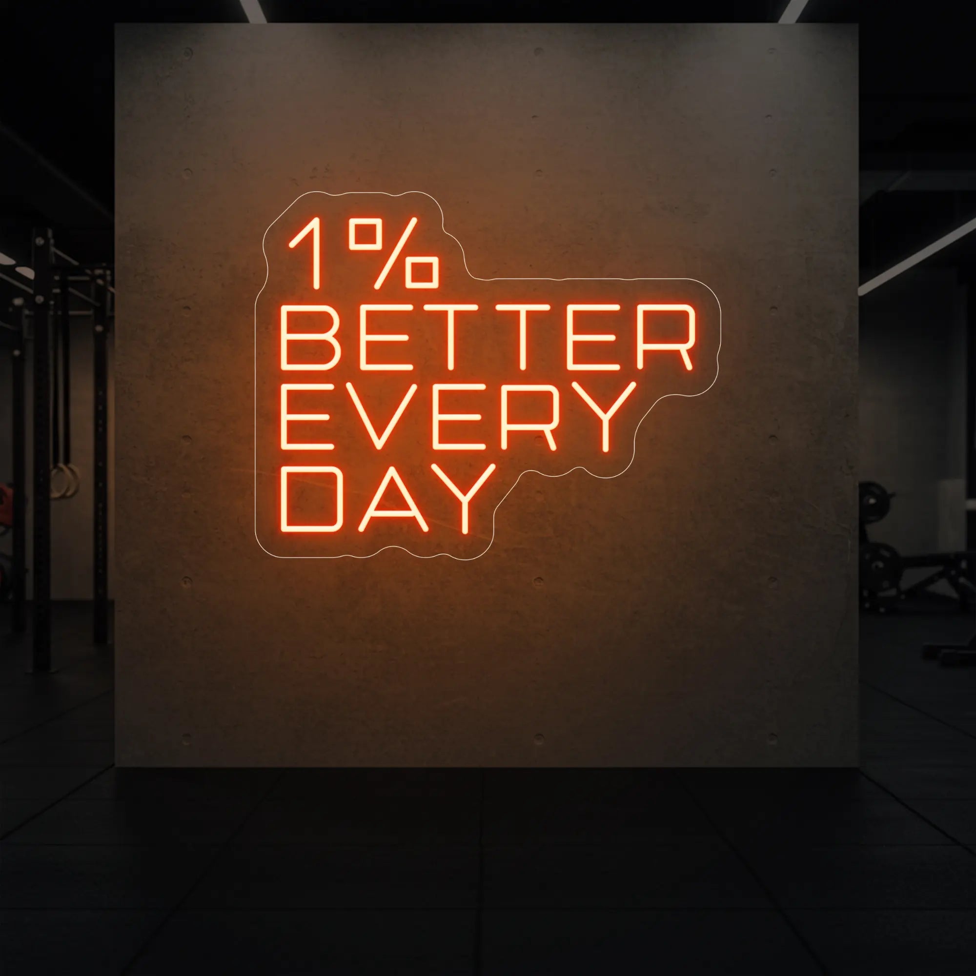 '1% Better Every Day' neon sign glowing in golden yellow against a styled interior wall.
