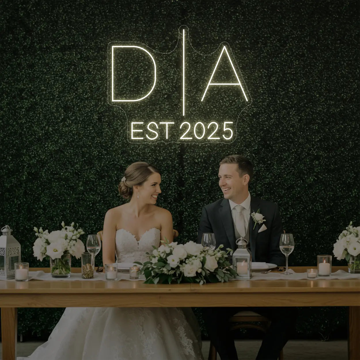 Photo of the 'Wedding Initials Custom Neon Sign V3' neon sign glowing in warm white against a styled interior wall.