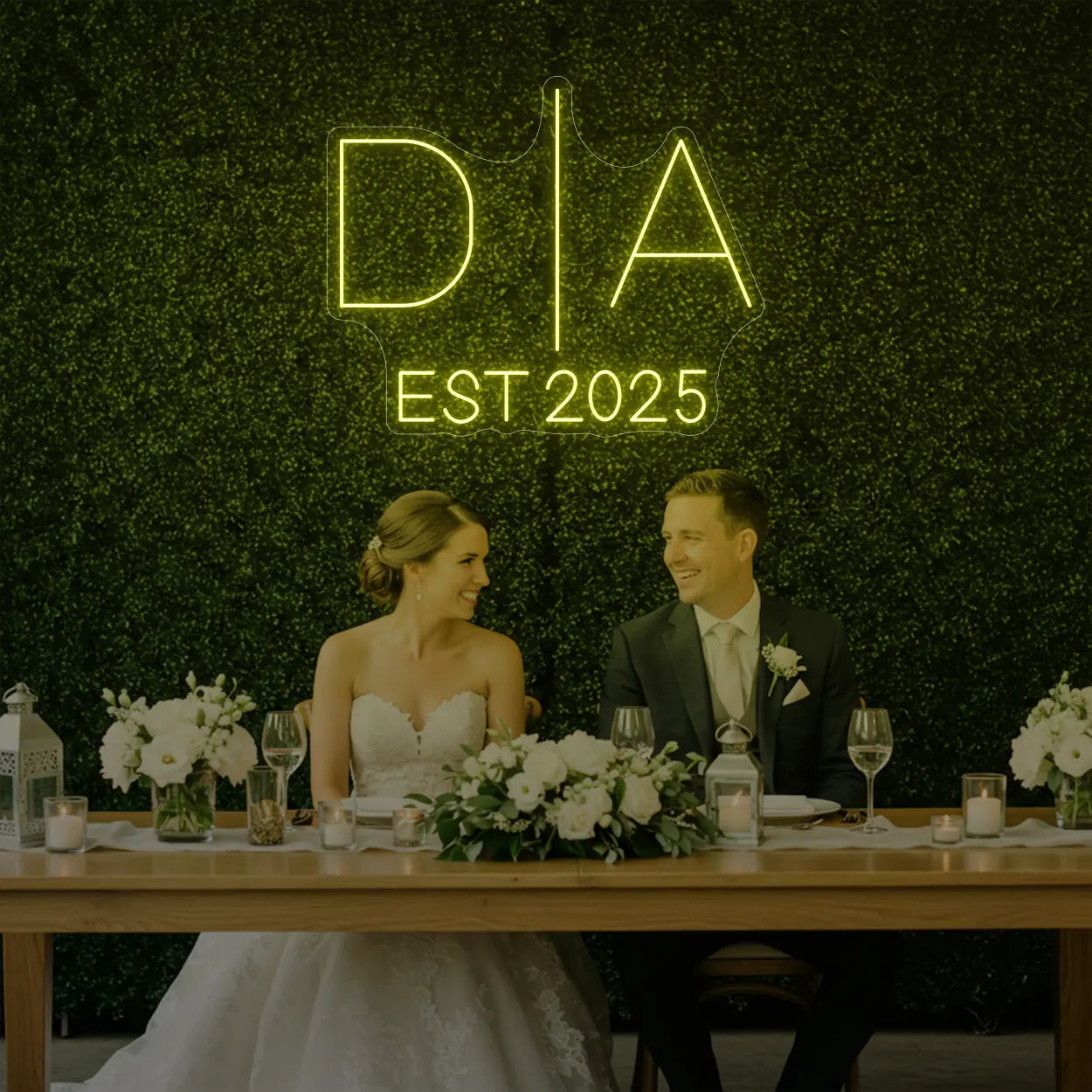 Photo of the 'Wedding Initials Custom Neon Sign V3' neon sign glowing in lemon yellow against a styled interior wall.