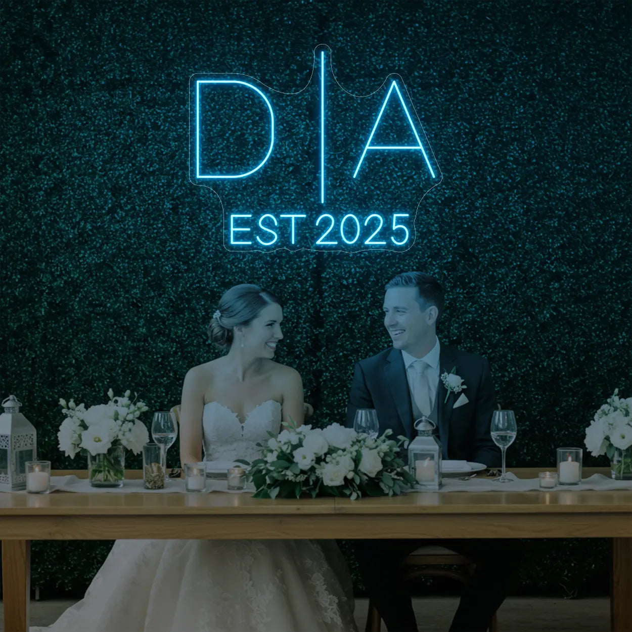 Photo of the 'Wedding Initials Custom Neon Sign V3' neon sign glowing in ice blue against a styled interior wall.