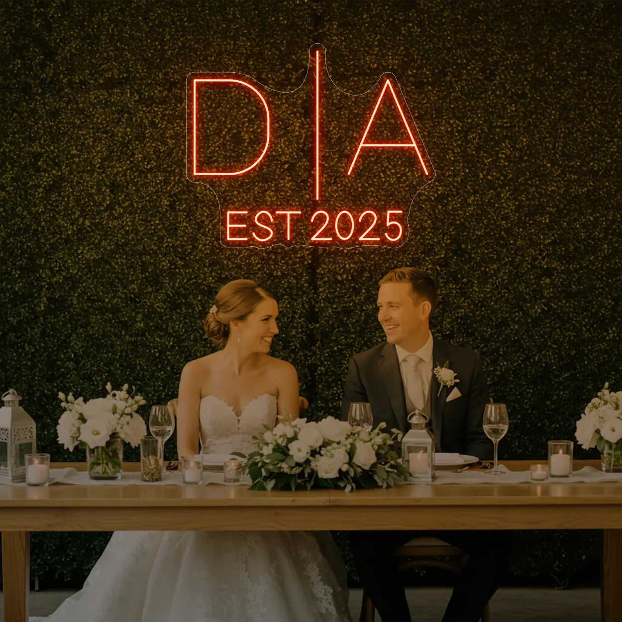Photo of the 'Wedding Initials Custom Neon Sign V3' neon sign glowing in golden yellow against a styled interior wall.