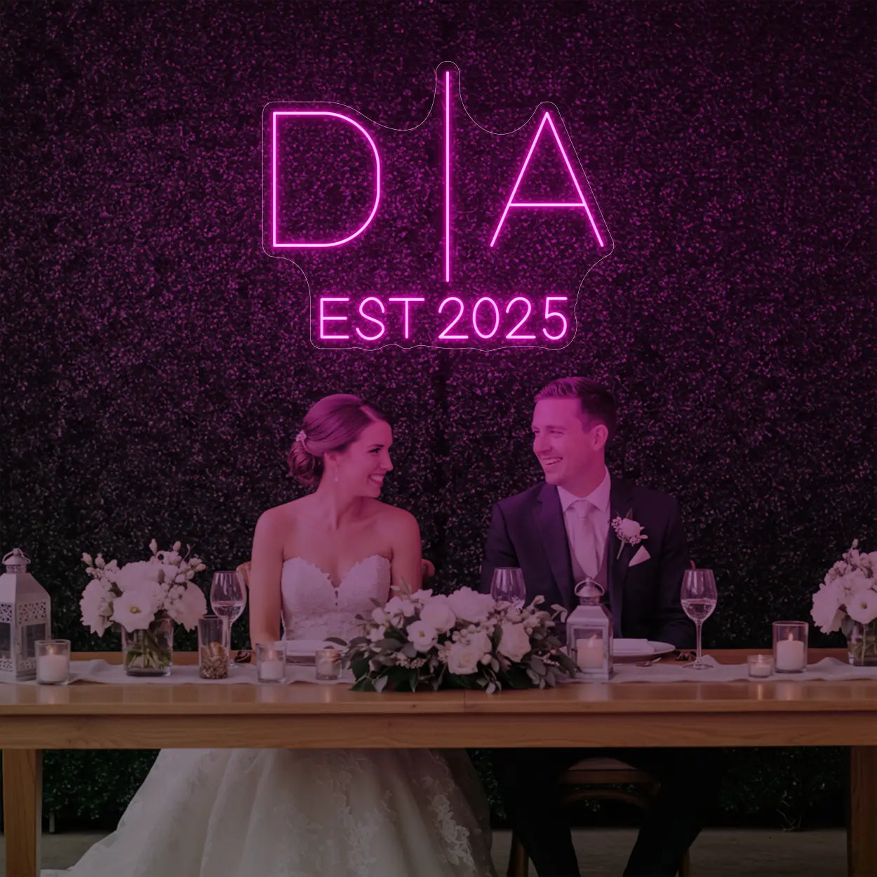 Photo of the 'Wedding Initials Custom Neon Sign V3' neon sign glowing in light pink against a styled interior wall.