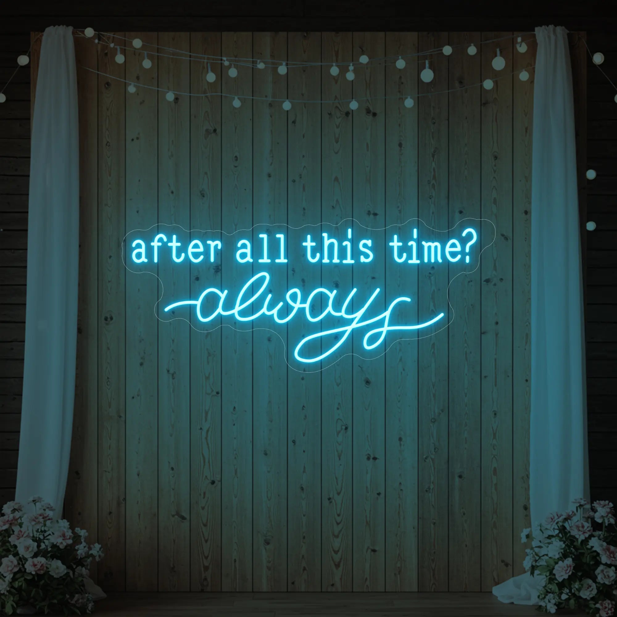 Photo of the 'After All This Time V1' neon sign glowing in ice blue against a styled interior wall.