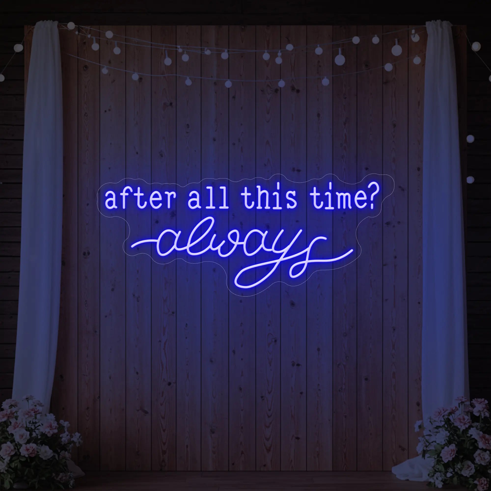 Photo of the 'After All This Time V1' neon sign glowing in deep blue against a styled interior wall.