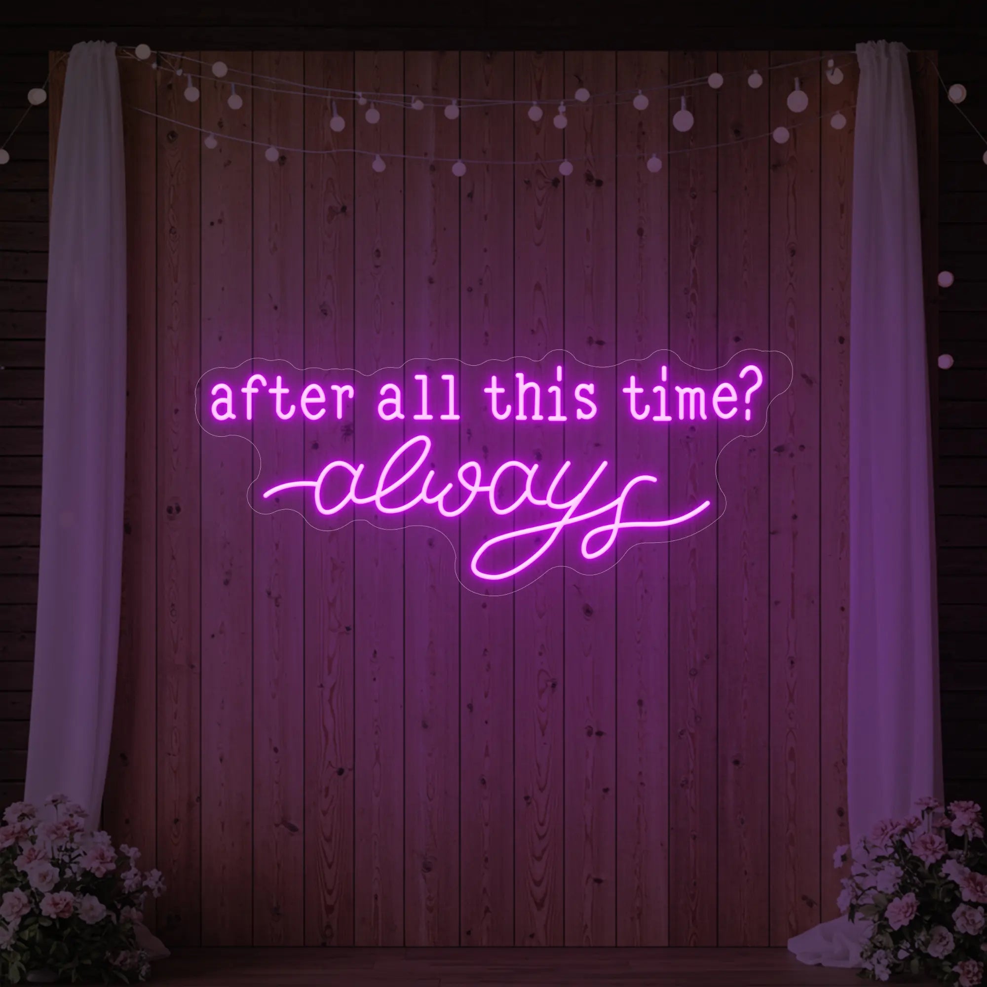 Photo of the 'After All This Time V1' neon sign glowing in deep pink against a styled interior wall.