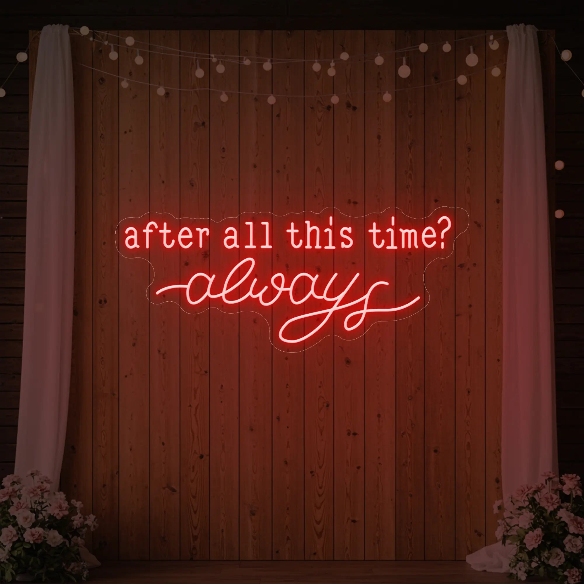Photo of the 'After All This Time V1' neon sign glowing in red against a styled interior wall.