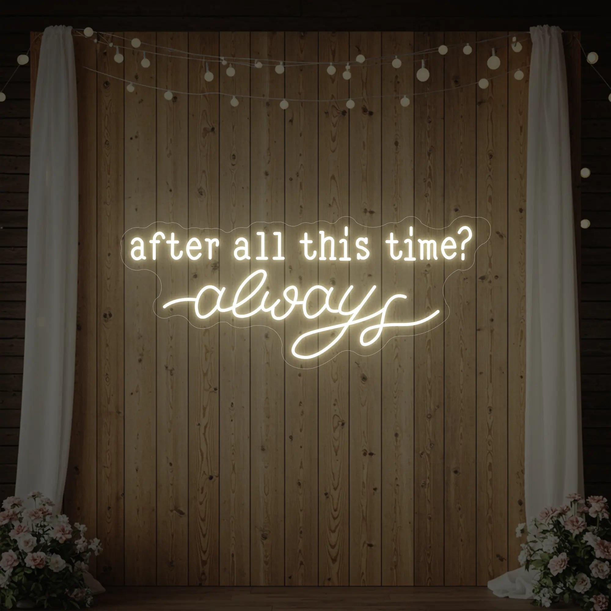 Photo of the 'After All This Time V1' neon sign glowing in warm white against a styled interior wall.