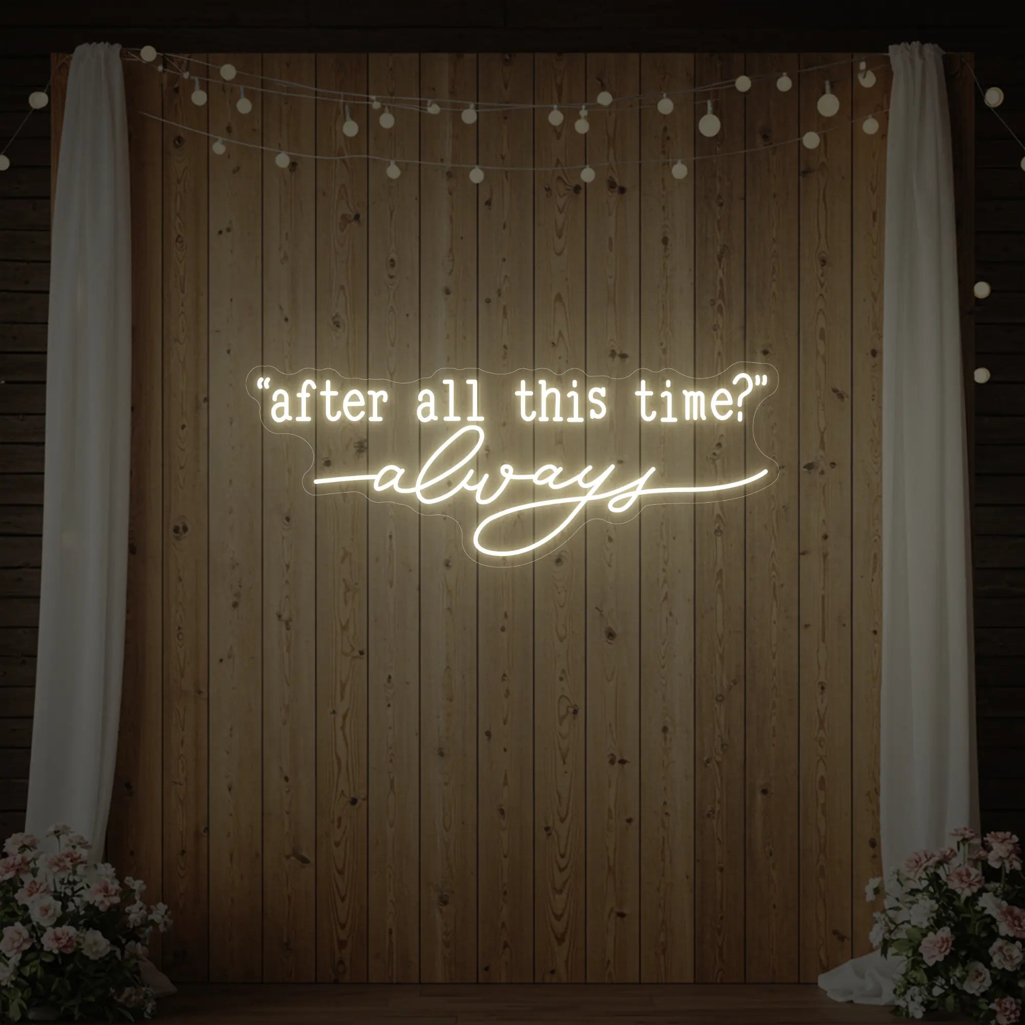Photo of the 'After All This Time V2' neon sign glowing in warm white against a styled interior wall.