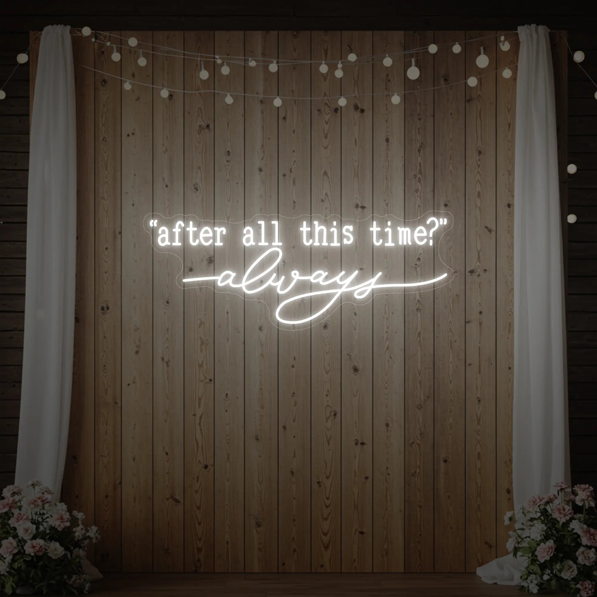 Photo of the 'After All This Time V2' neon sign glowing in cool white against a styled interior wall.