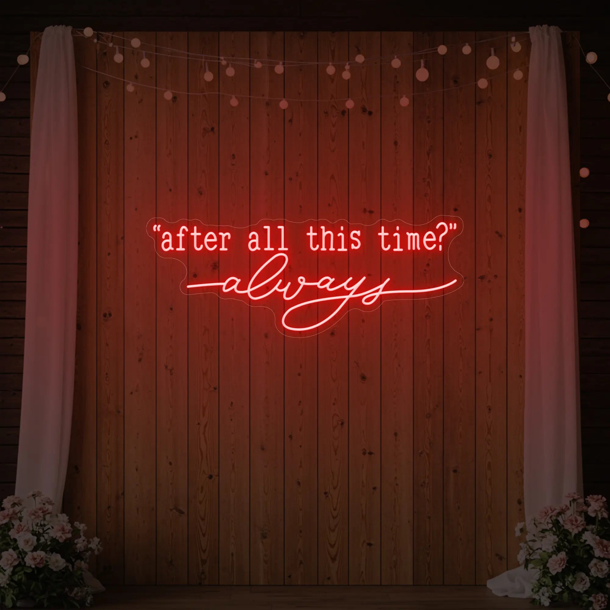 Photo of the 'After All This Time V2' neon sign glowing in red against a styled interior wall.