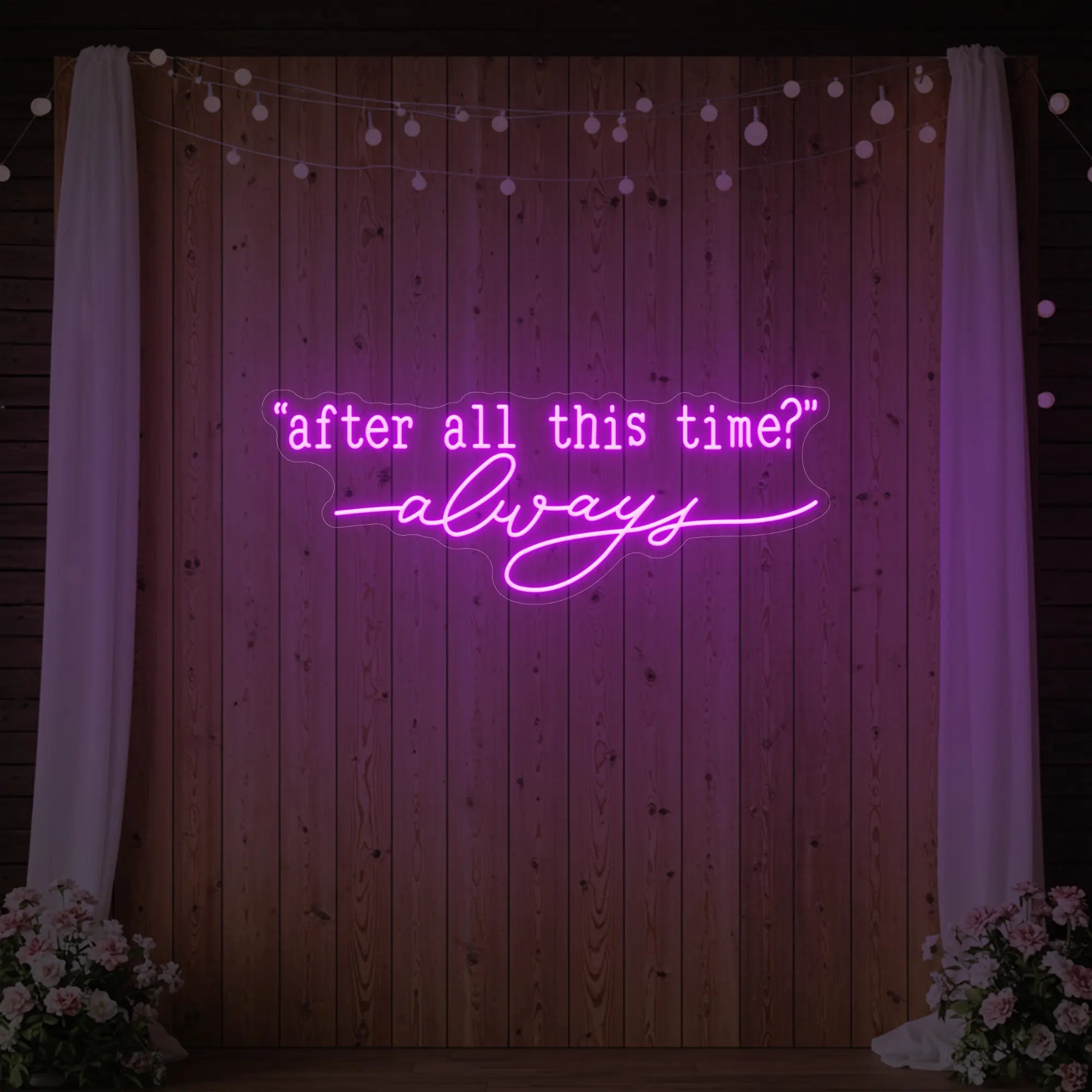 Photo of the 'After All This Time V2' neon sign glowing in deep pink against a styled interior wall.