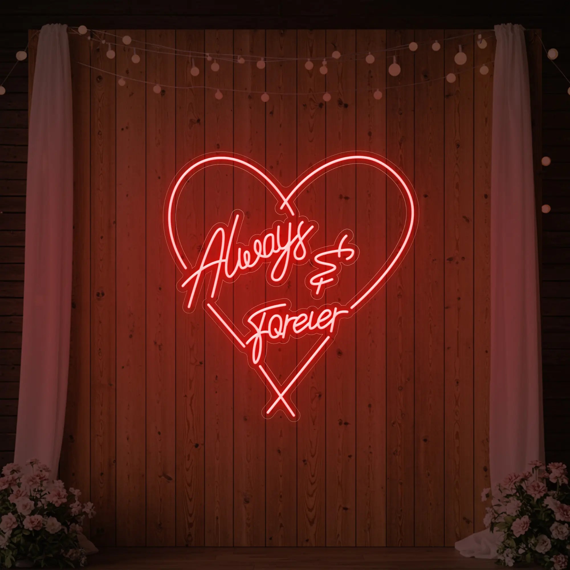 Photo of the 'Always & Forever' neon sign glowing in red against a styled interior wall.