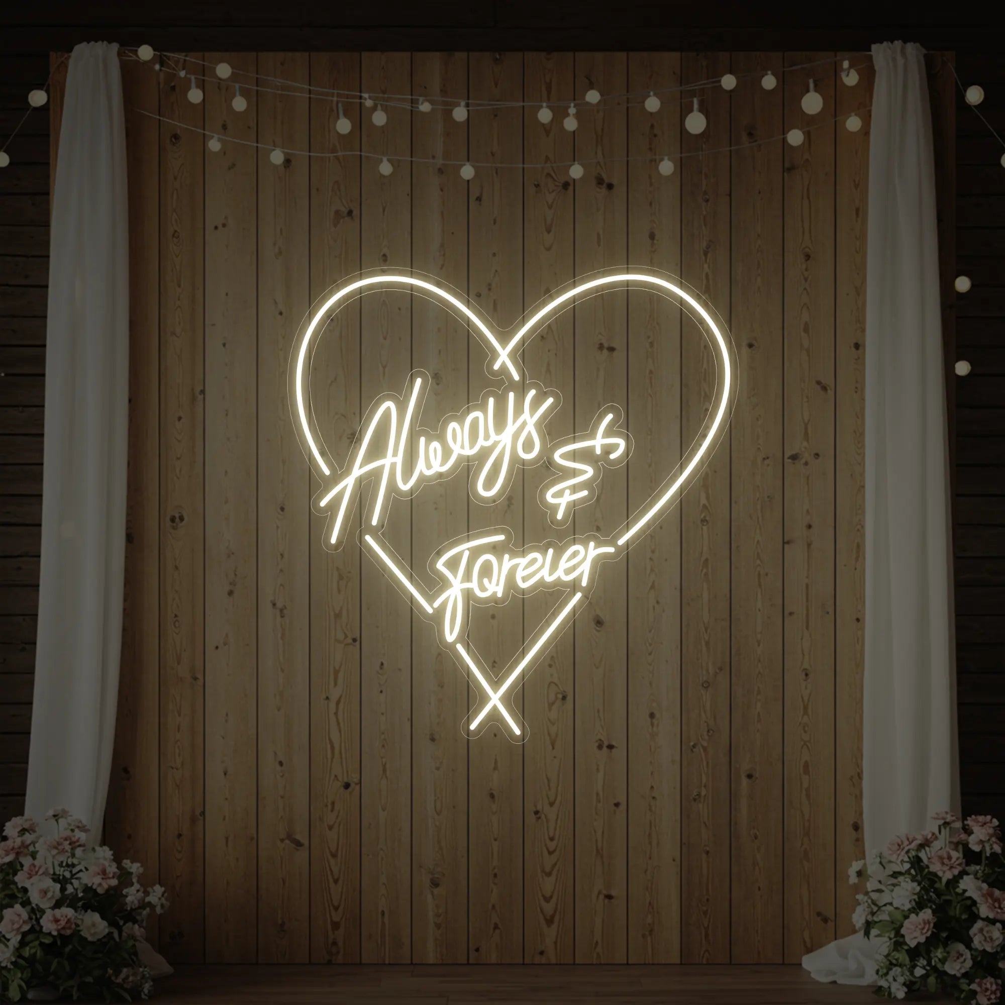 Photo of the 'Always & Forever' neon sign glowing in warm white against a styled interior wall.
