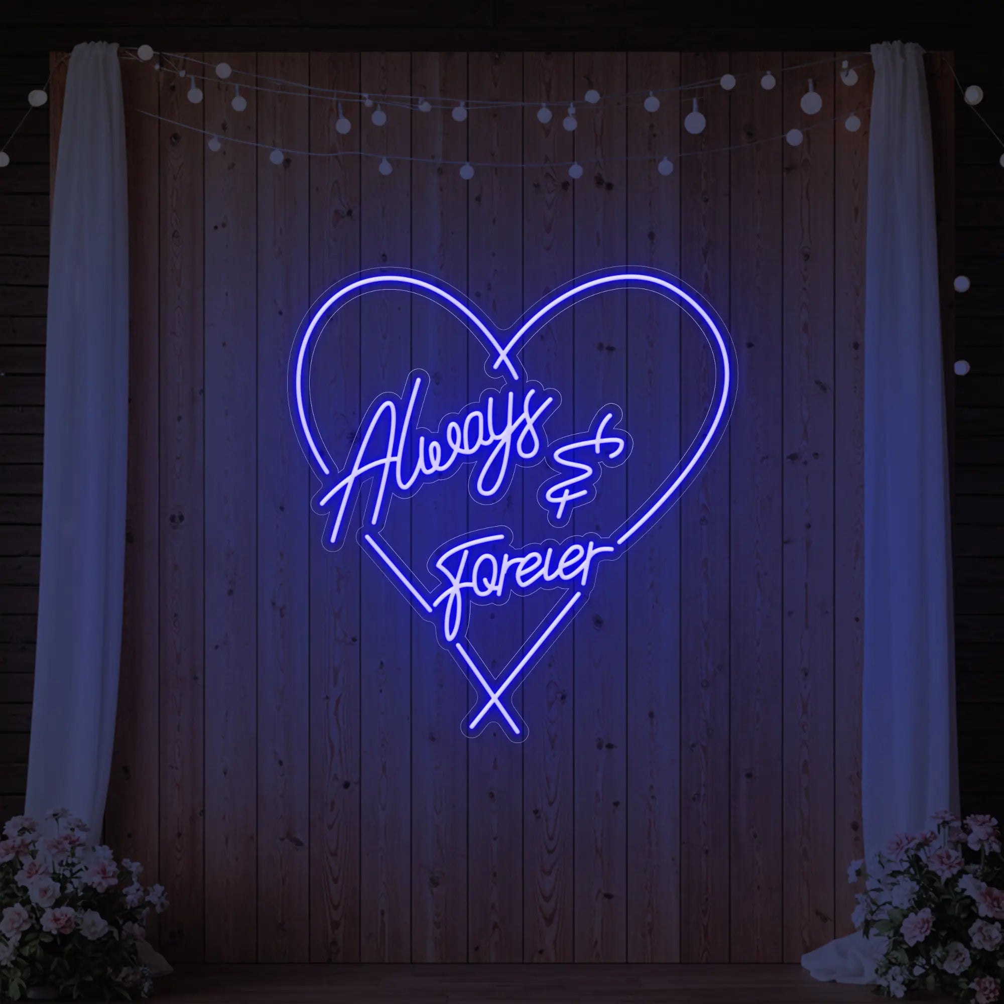 Photo of the 'Always & Forever' neon sign glowing in deep blue against a styled interior wall.
