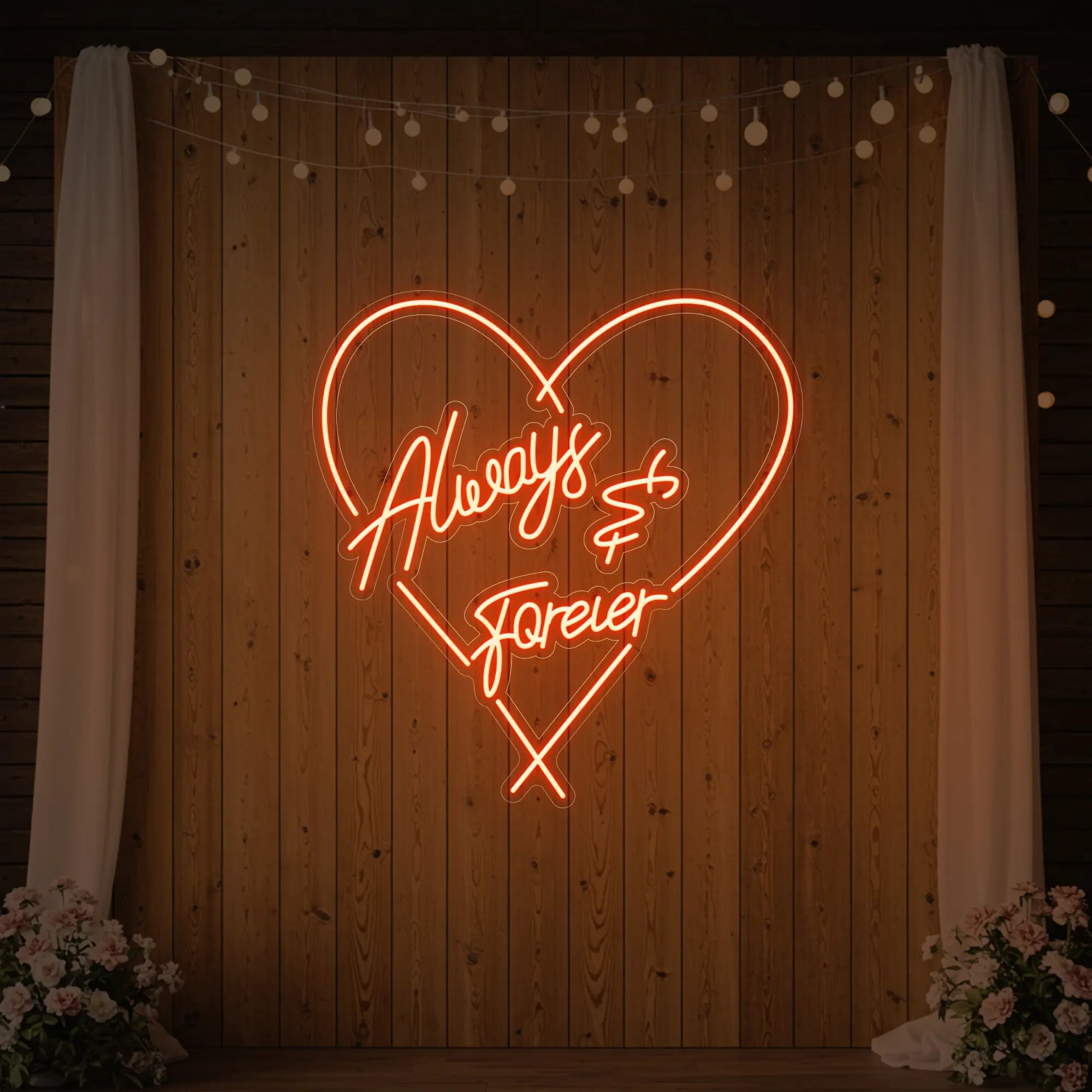 Photo of the 'Always & Forever' neon sign glowing in golden yellow against a styled interior wall.
