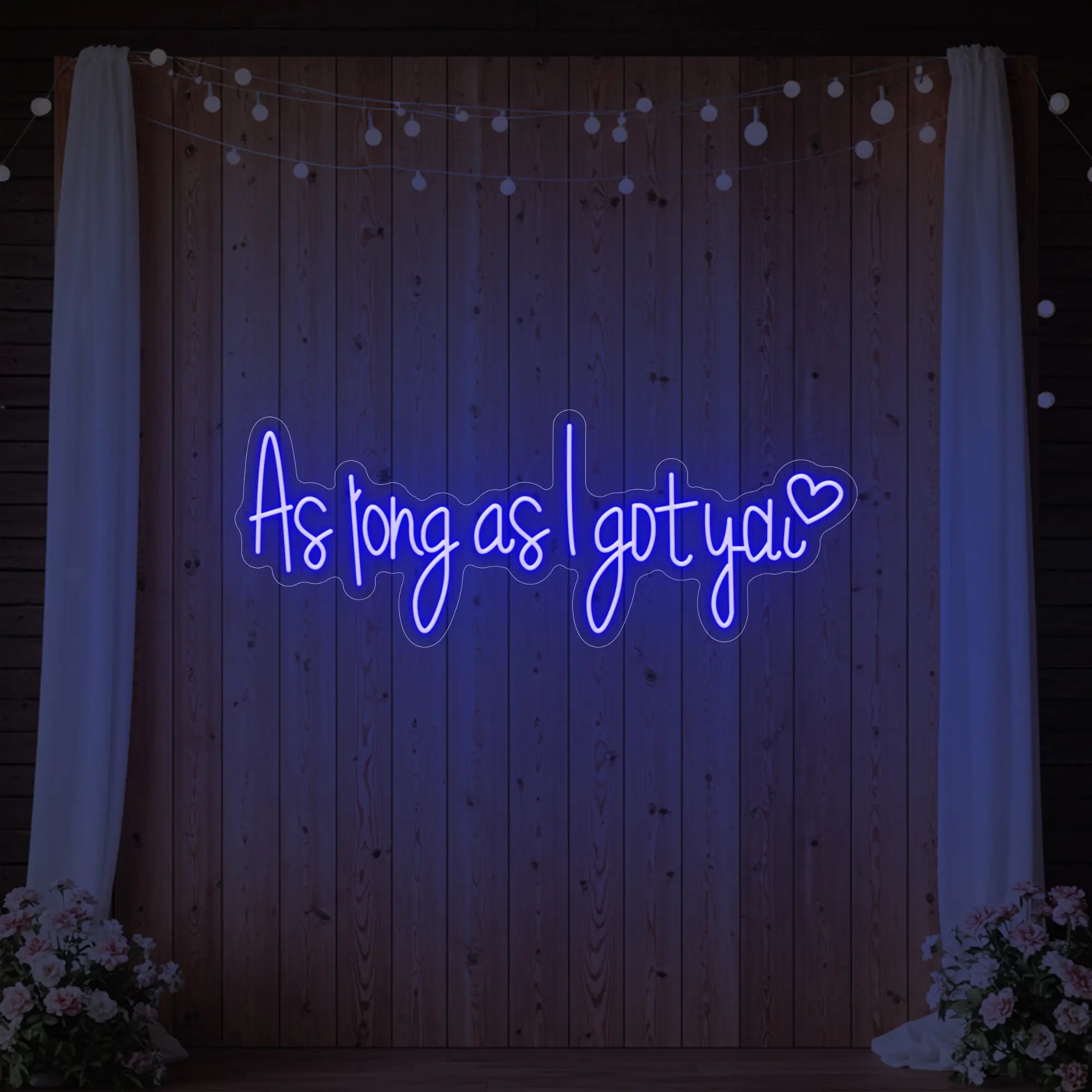Photo of the 'As Long As I Got You' neon sign glowing in deep blue against a styled interior wall.