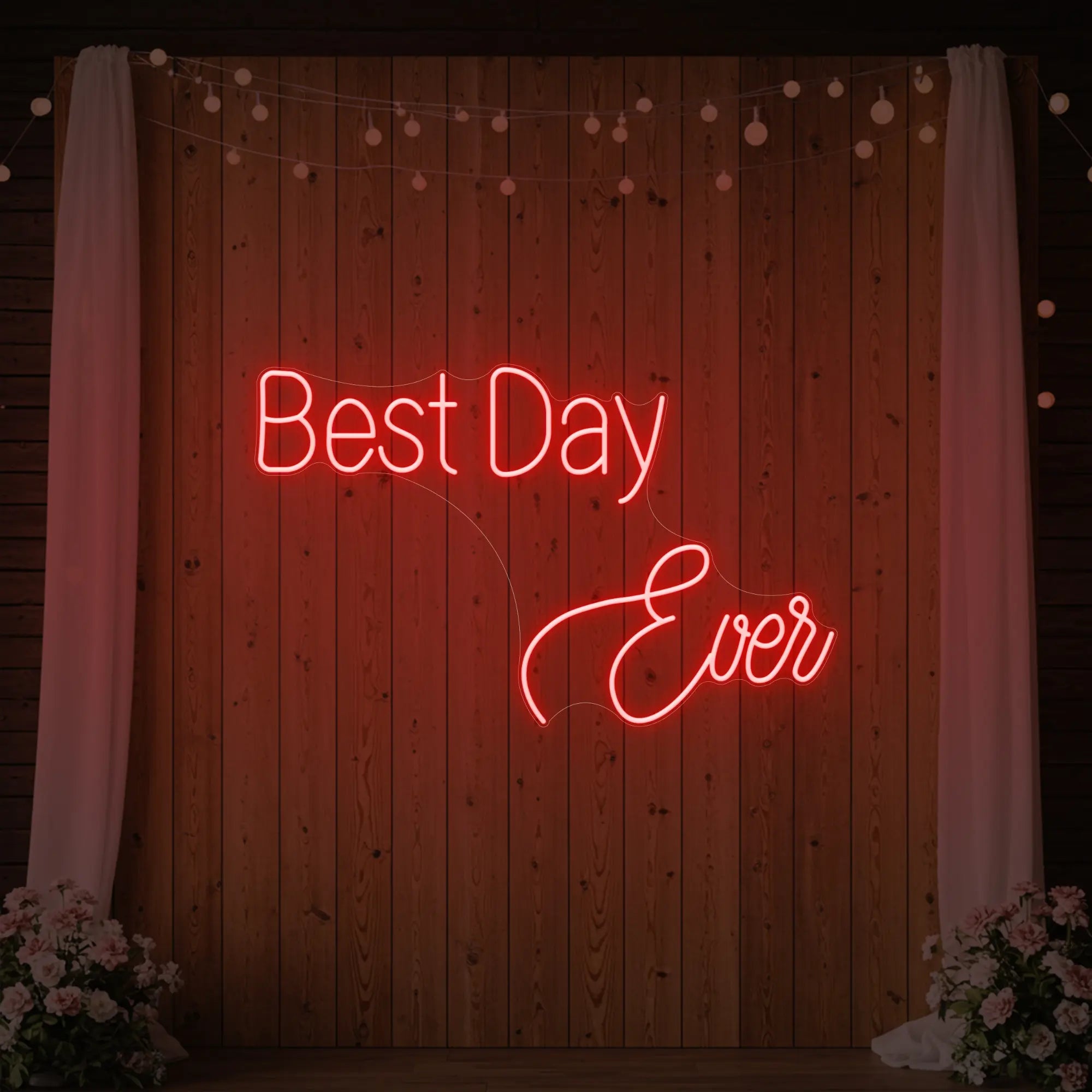 Photo of the 'Best Day Ever' neon sign glowing in red against a styled interior wall.