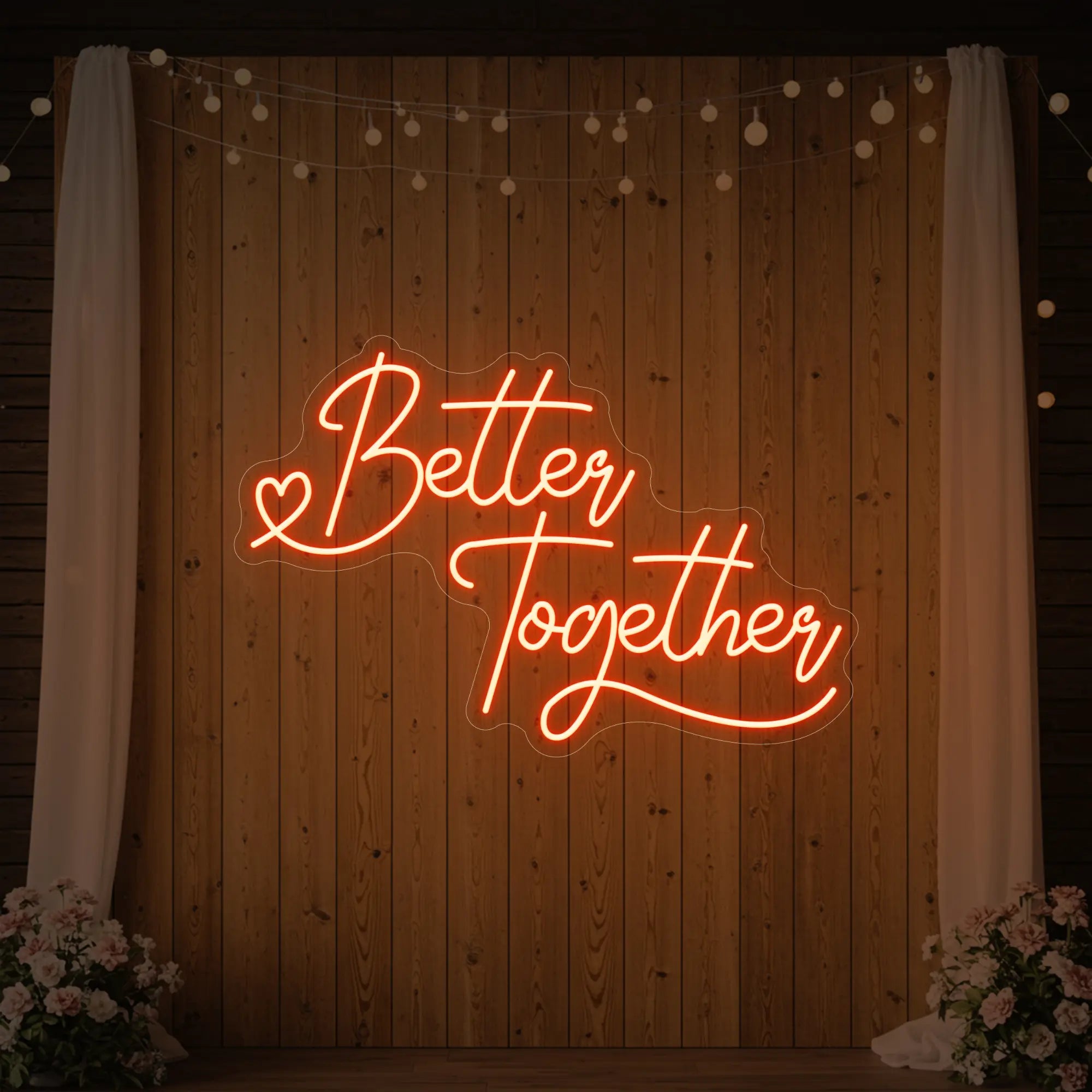 Photo of the 'Better Together' neon sign glowing in golden yellow against a styled interior wall.