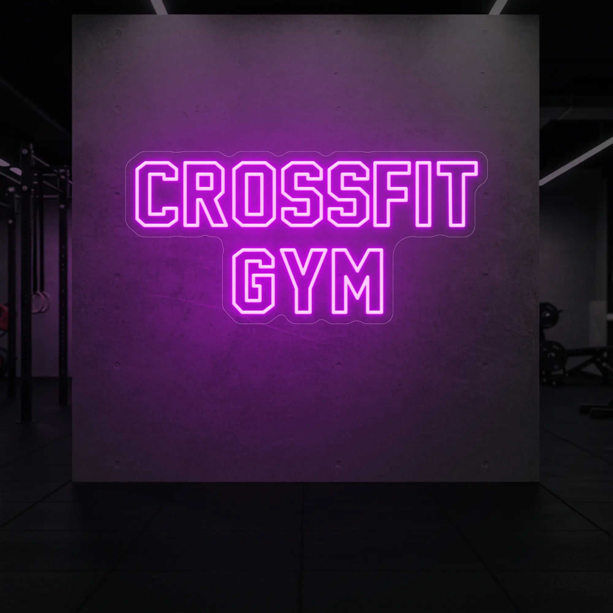 'CrossFit Gym' neon sign glowing in deep pink against a styled interior wall.