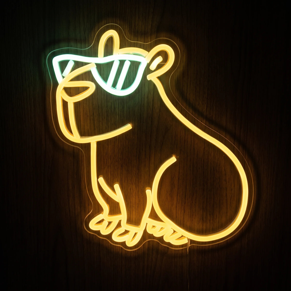 Cute capybara LED neon sign with warm yellow animal outline, cool white sunglasses, and clear acrylic backing.
