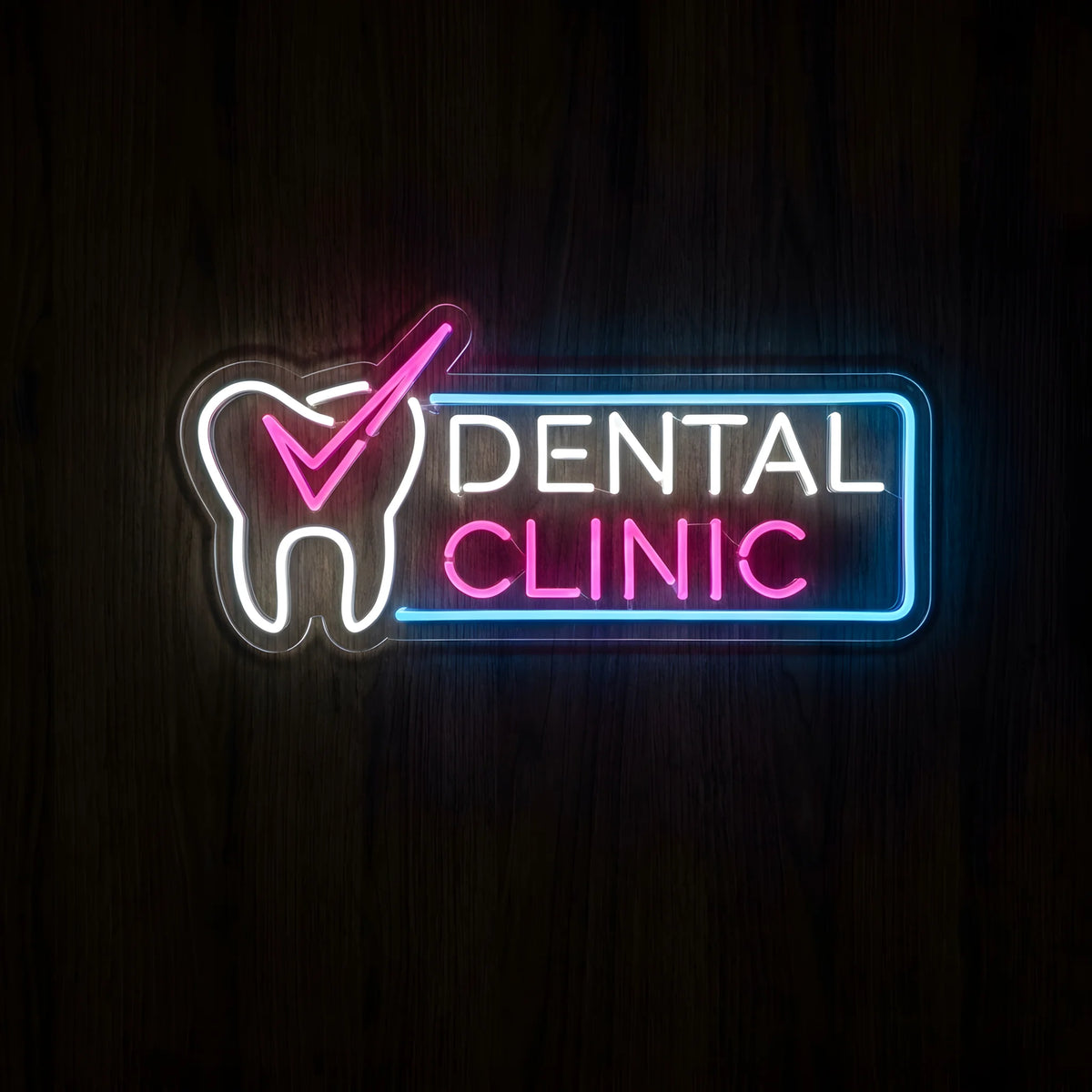 Dental Clinic Checkmark LED neon sign featuring a white tooth with a pink checkmark beside white DENTAL and pink CLINIC lettering inside a blue neon border on clear acrylic backing.