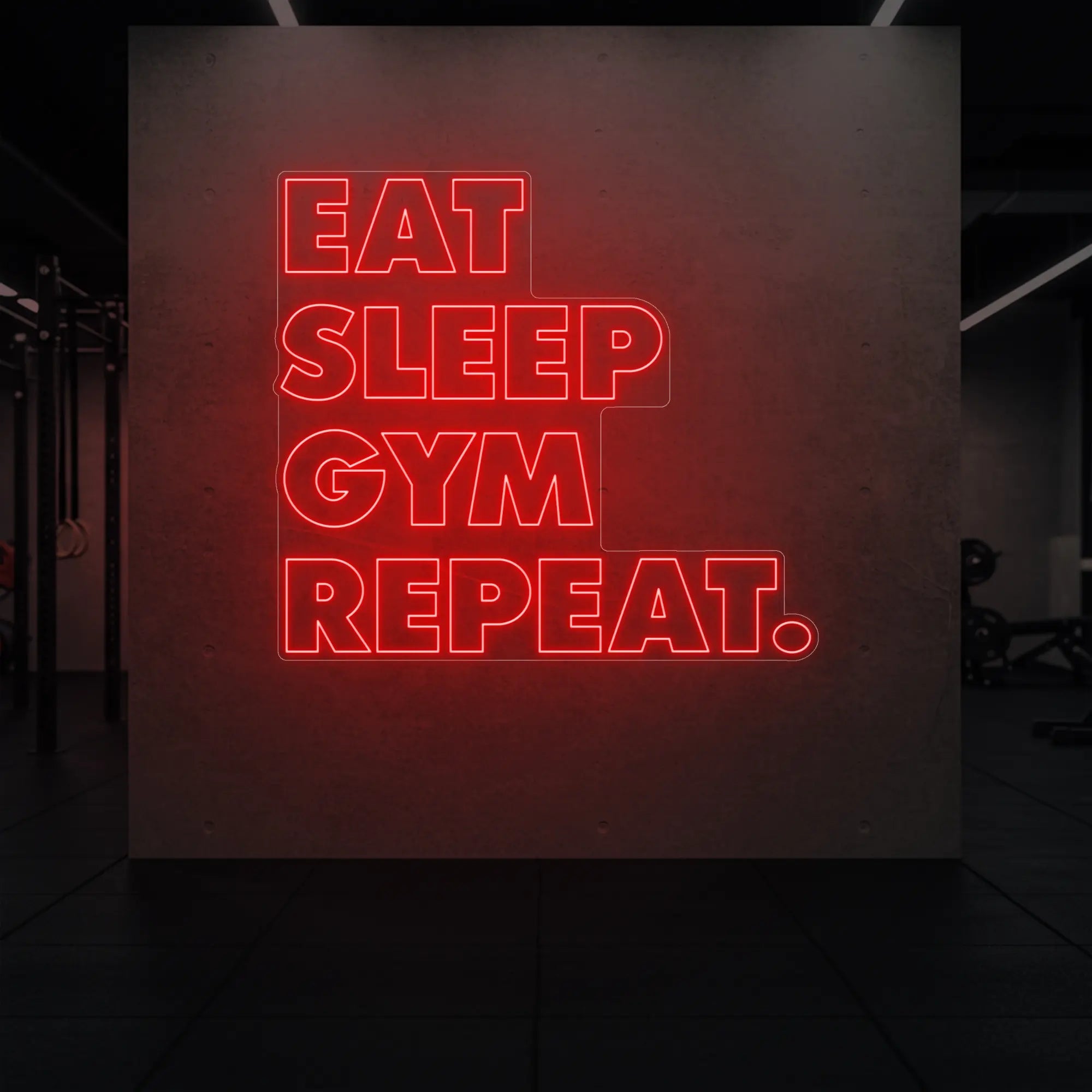 'Eat Sleep Gym Repeat' neon sign glowing in red against a styled interior wall.