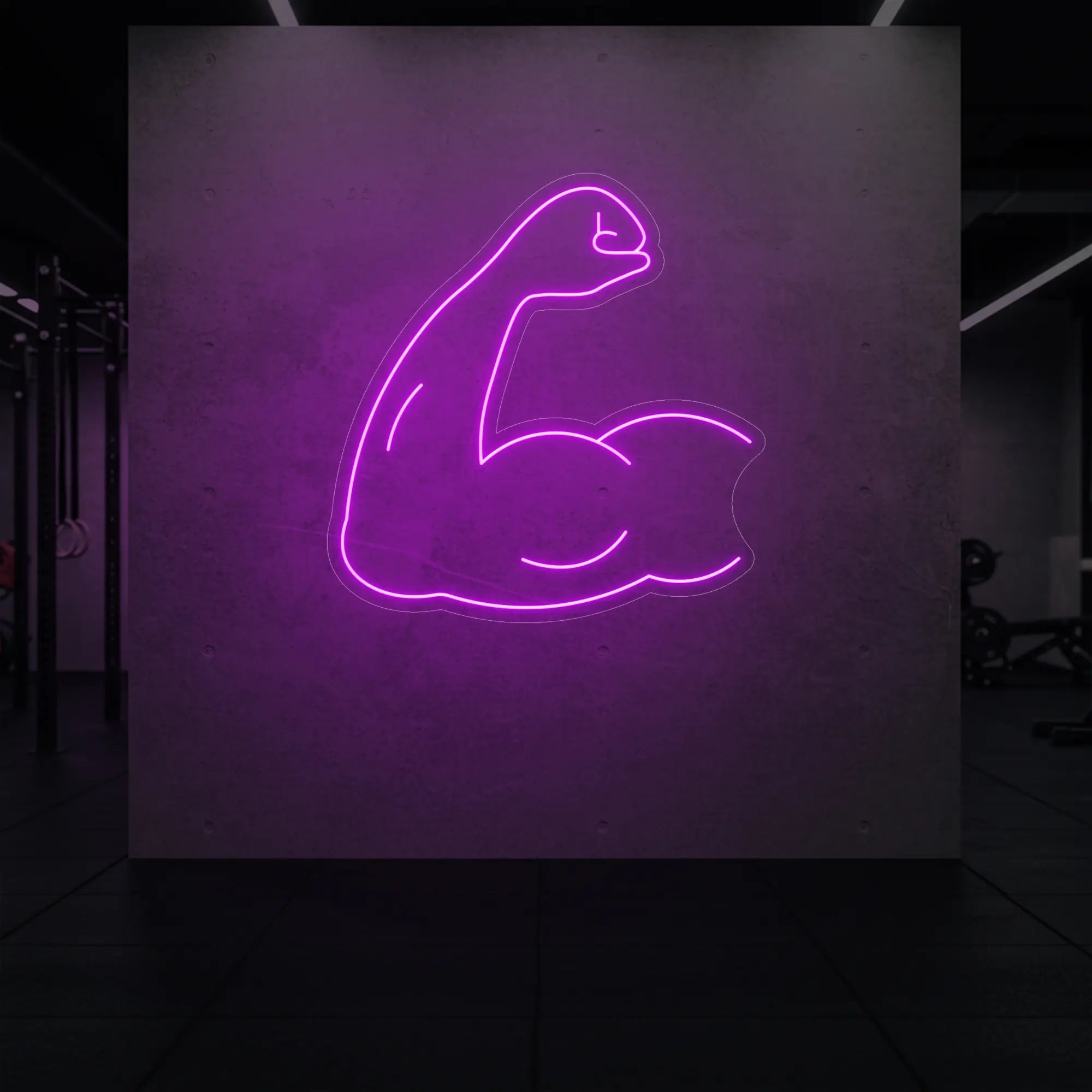 'Flexing Bicep Arm' neon sign glowing in deep pink against a styled interior wall.