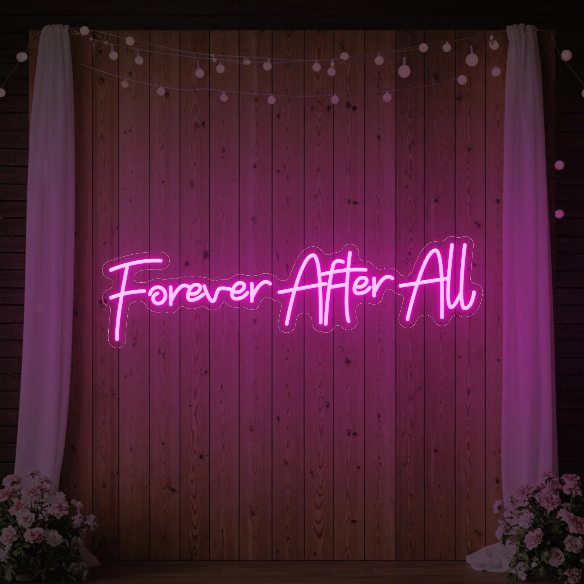 Photo of the 'Forever After All' neon sign glowing in light pink against a styled interior wall.