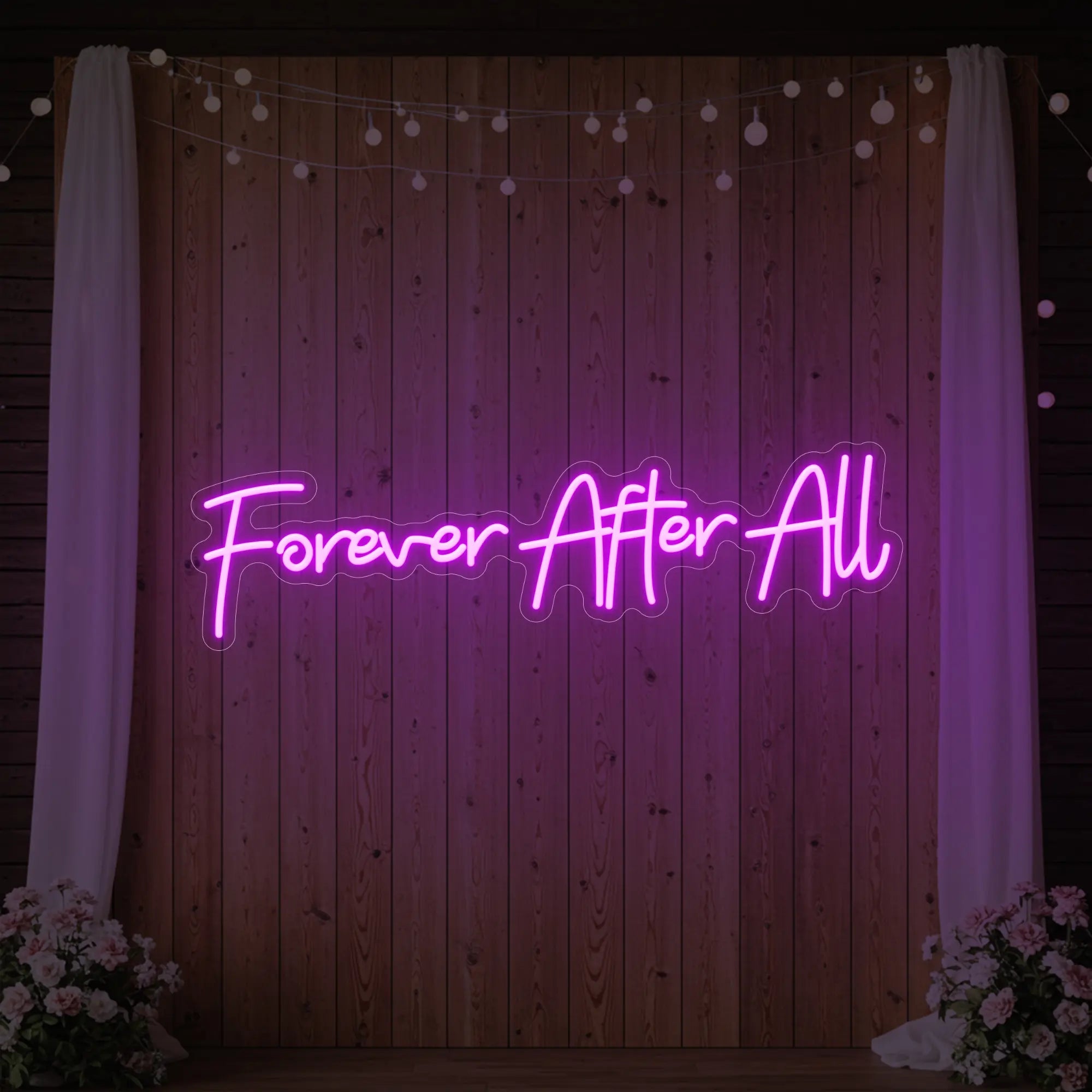 Photo of the 'Forever After All' neon sign glowing in deep pink against a styled interior wall.