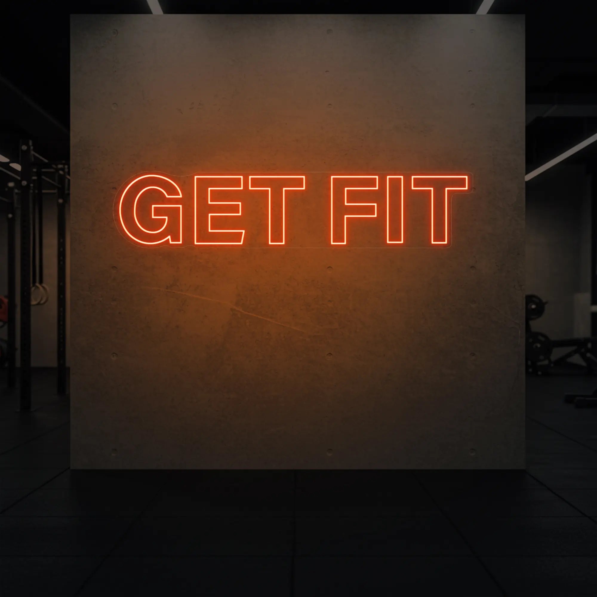 'Get Fit' neon sign glowing in golden yellow against a styled interior wall.
