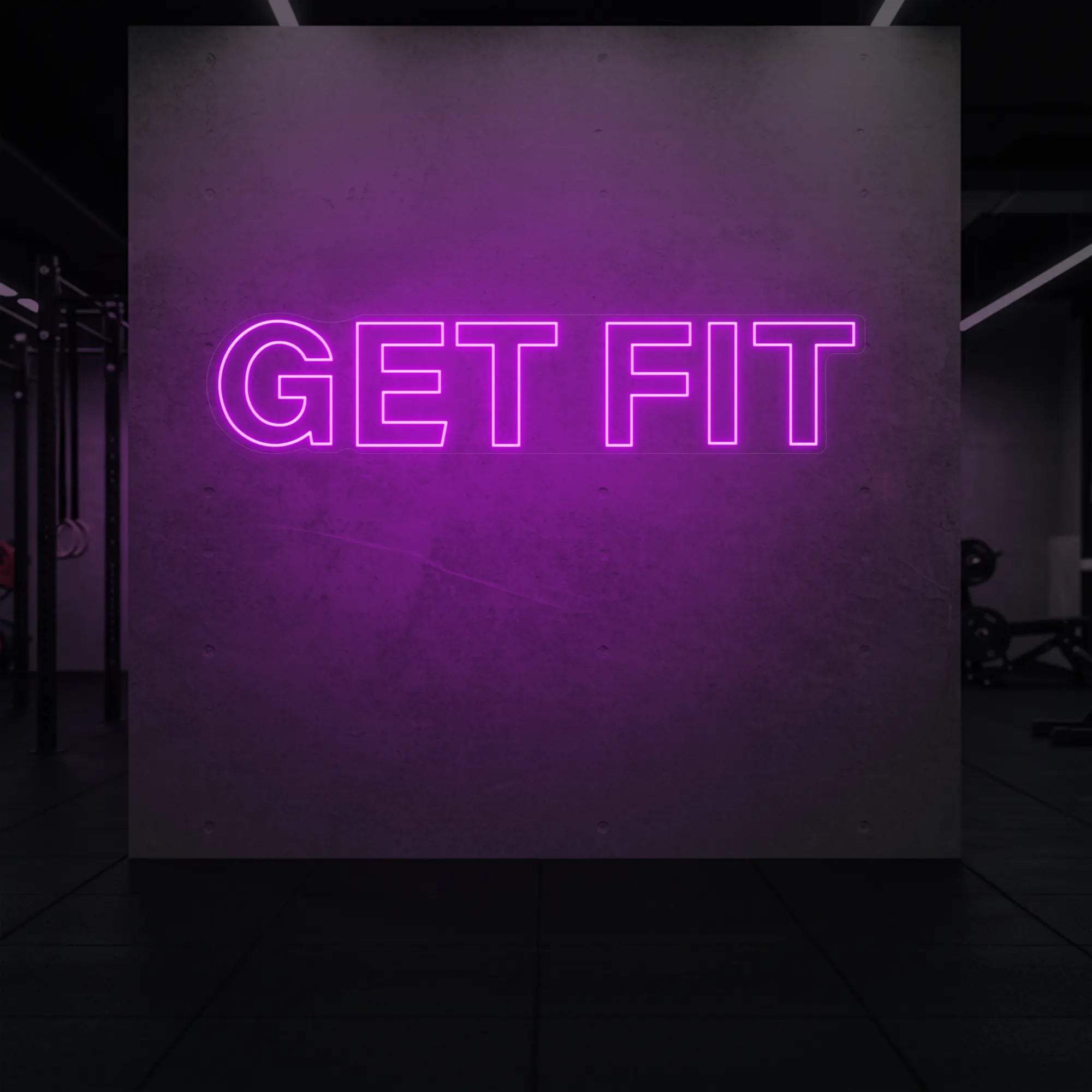 'Get Fit' neon sign glowing in dep pink against a styled interior wall.