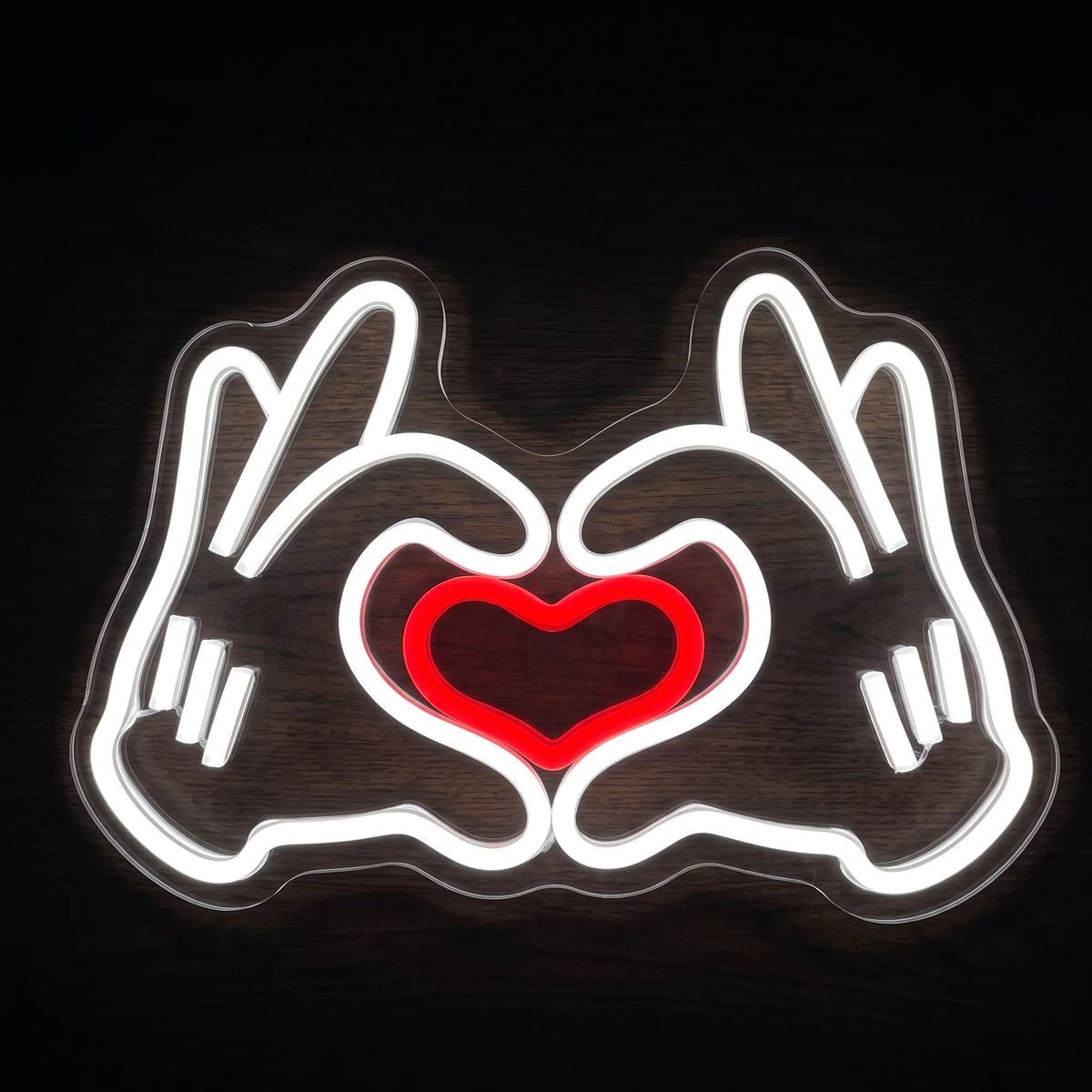 Heart Hands LED Neon Sign with white hand outlines forming a heart around a glowing red heart.