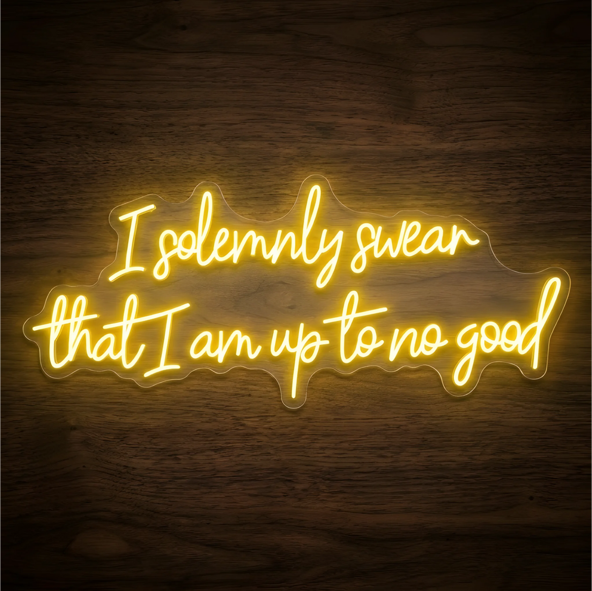 I Am Up to No Good LED Neon Sign displaying “I solemnly swear that I am up to no good” in glowing yellow script on clear acrylic against a dark wood background, suited to game rooms and home bars.