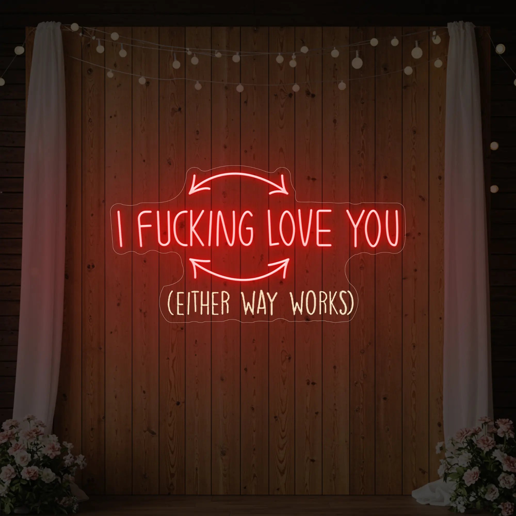Photo of the 'I F'ing Love You' neon sign glowing in red against a styled interior wall.