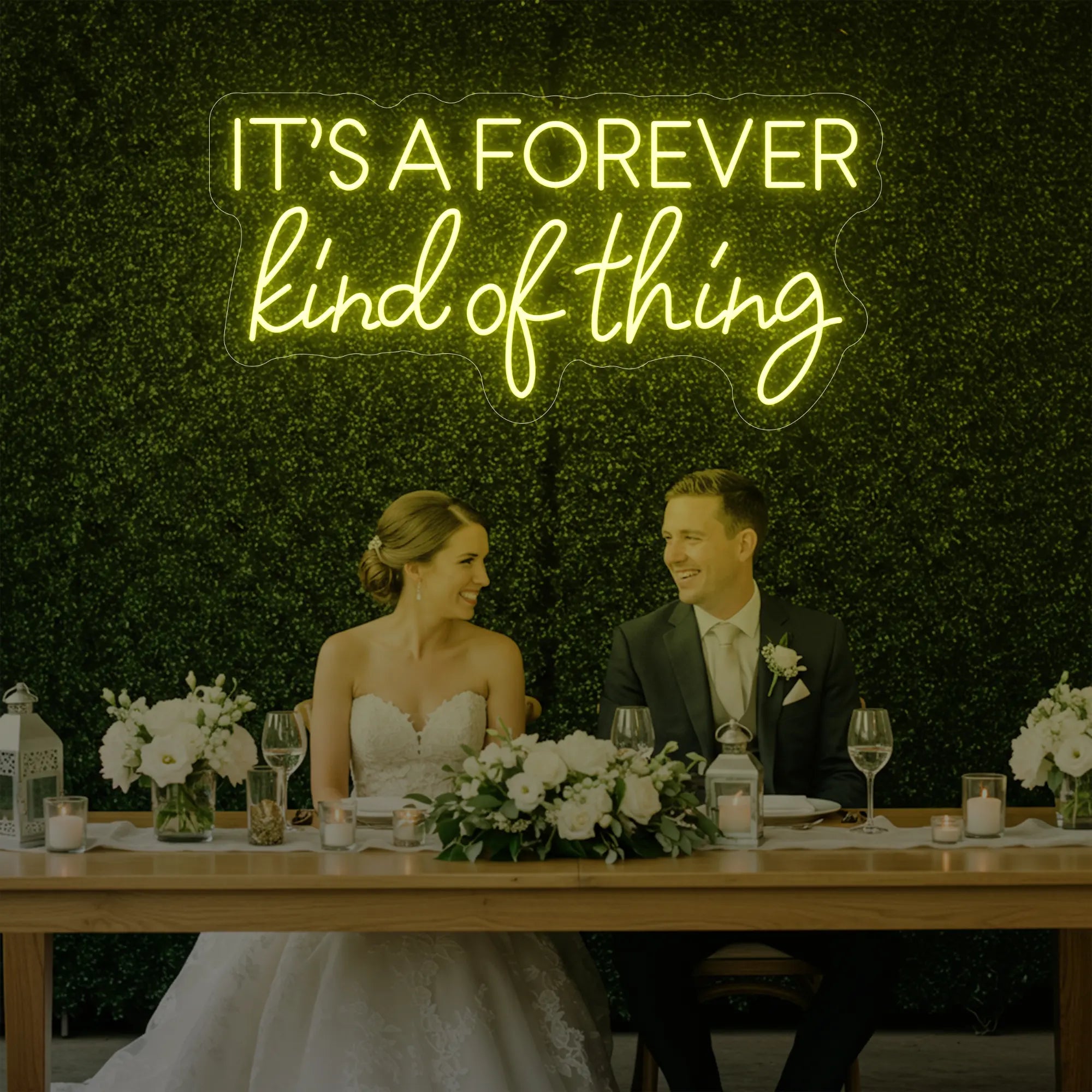 Photo of the 'It’s a Forever Kind of Thing' neon sign glowing in lemon yellow against a styled interior wall.