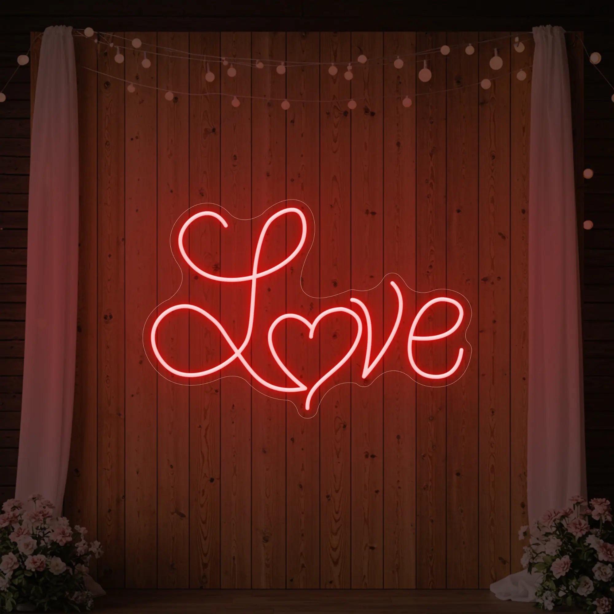 Photo of the 'Love Heart' neon sign glowing in red against a styled interior wall.