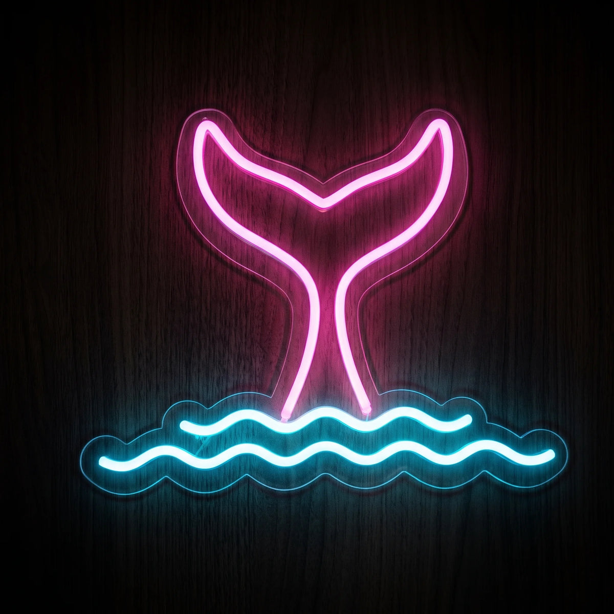 Mermaid tail LED neon sign with bright pink tail and blue ocean waves on clear acrylic backing.