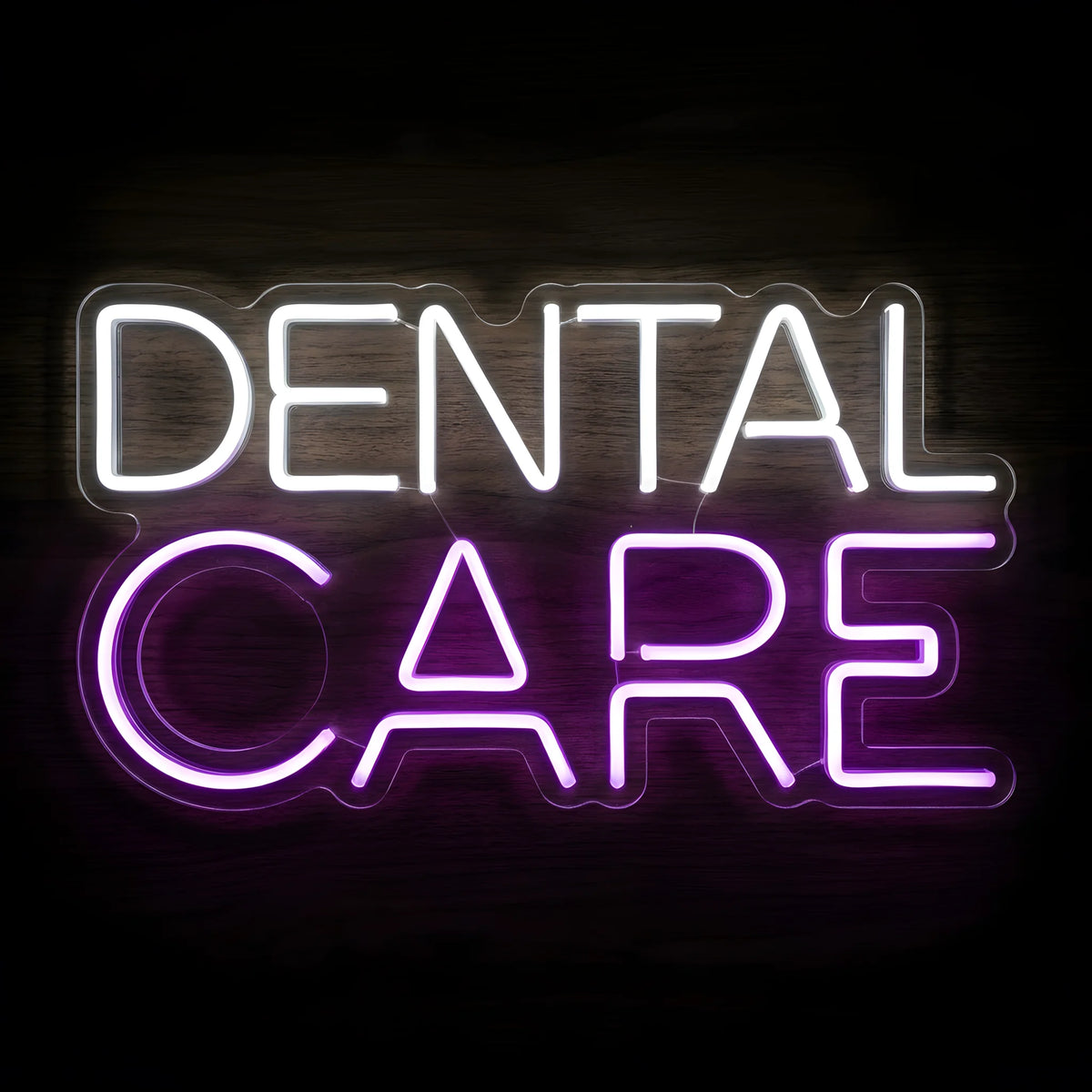 Modern Dental Care Typography LED neon sign featuring bright cool white DENTAL lettering above vibrant purple CARE lettering on precision-cut clear acrylic backing for dental clinic wall decor.