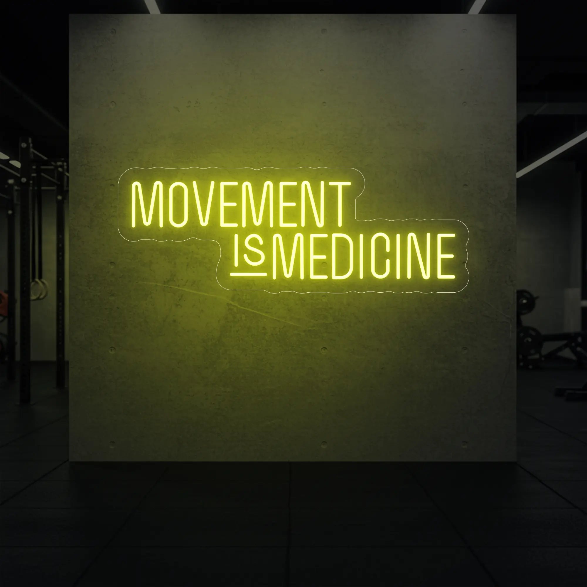 'Movement Is Medicine' neon sign glowing in lemon yellow against a styled interior wall.