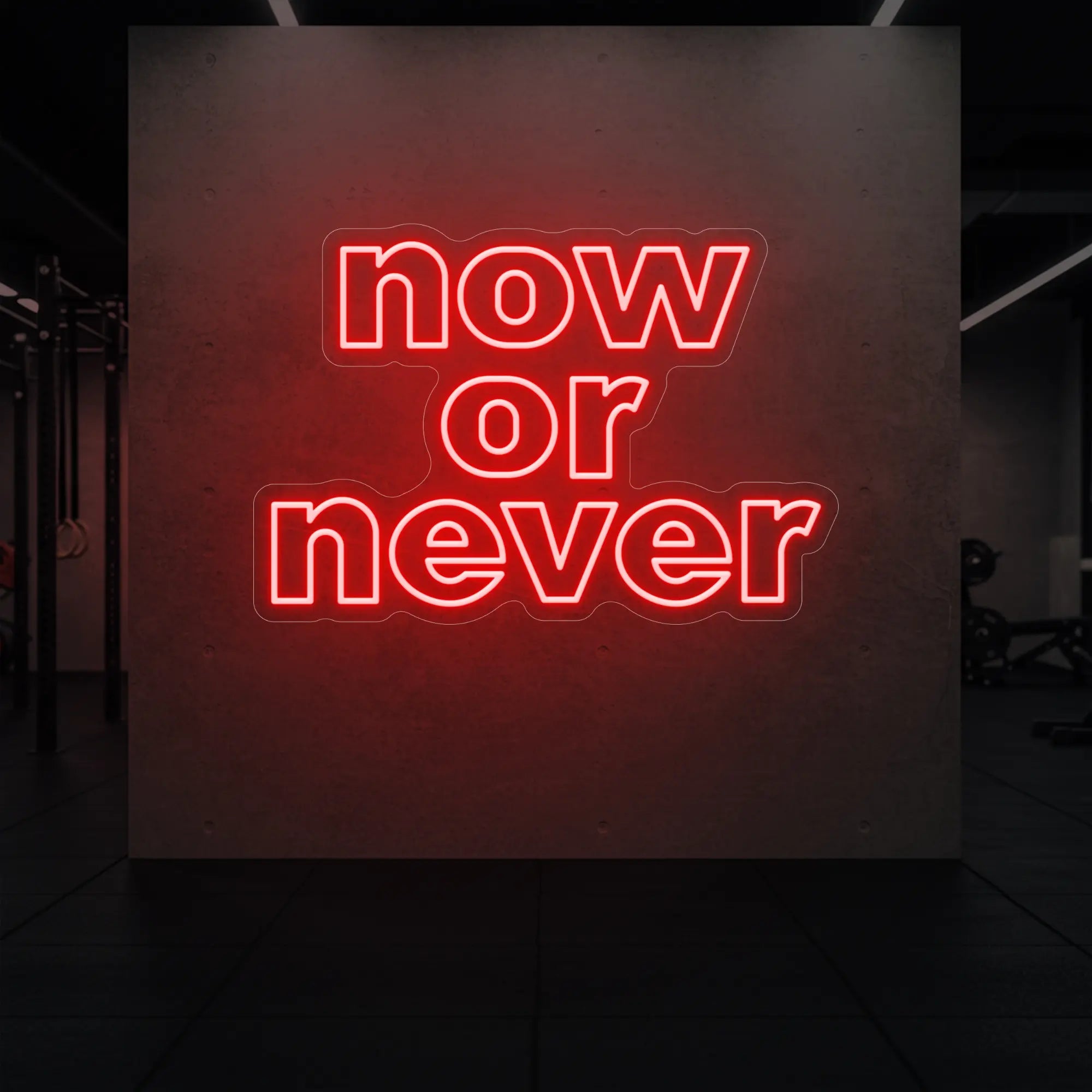 'Now or Never' neon sign glowing in red against a styled interior wall.