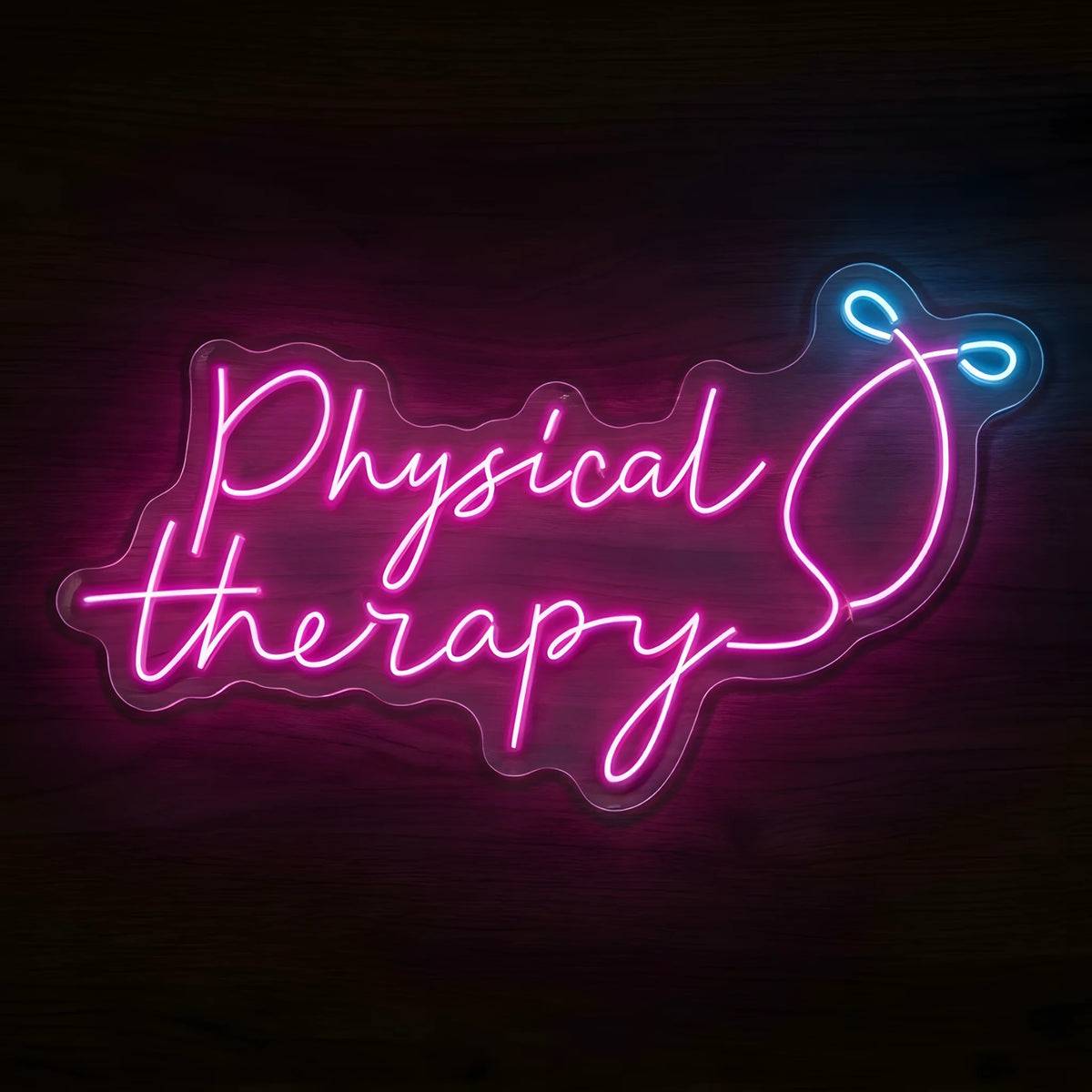 Physical Therapy Body Outline LED Neon Sign featuring pink cursive Physical Therapy lettering with a stylized body outline and blue accents on clear cut-to-shape acrylic against a dark wooden wall.