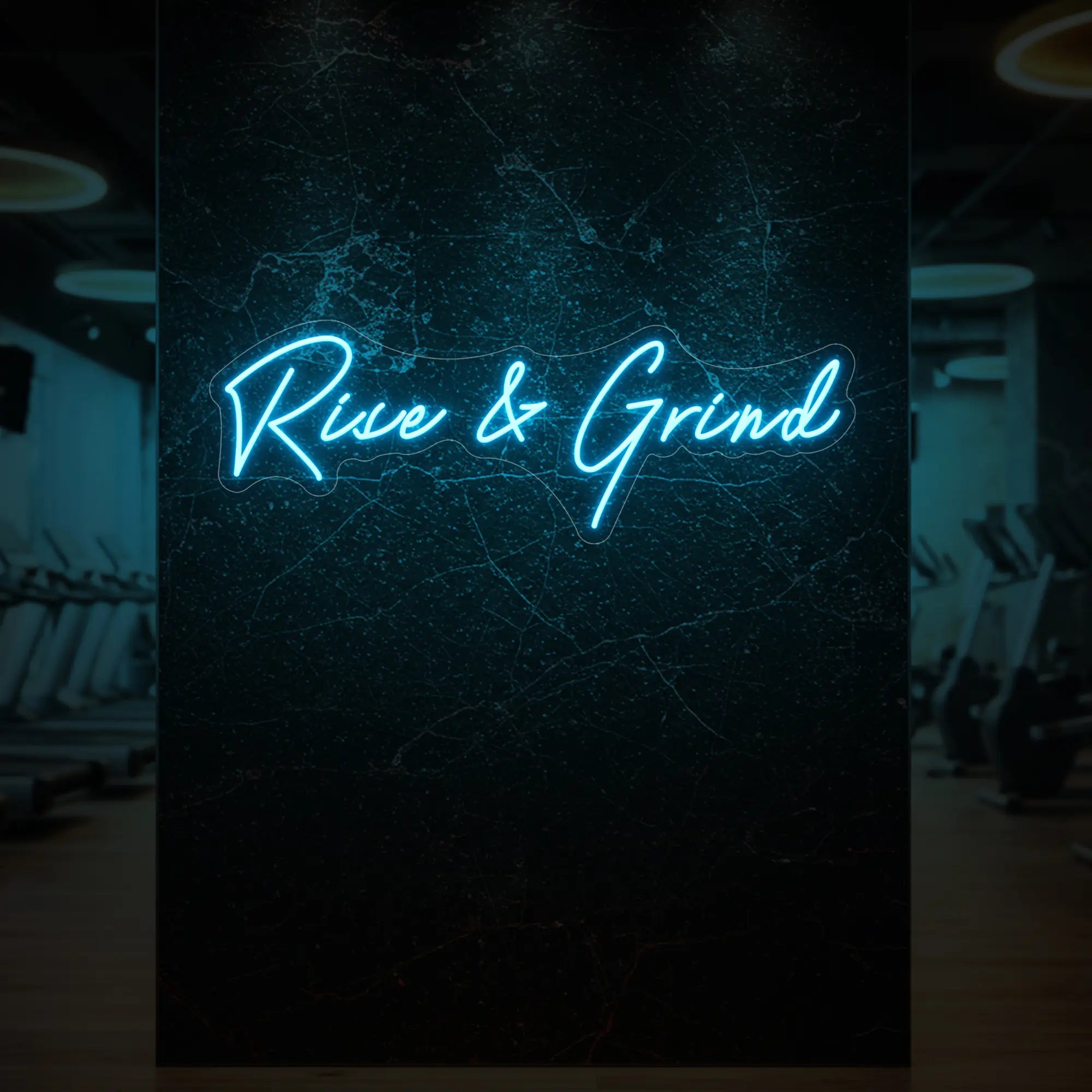 'Rise & Grind' neon sign glowing in ice blue against a styled interior wall.