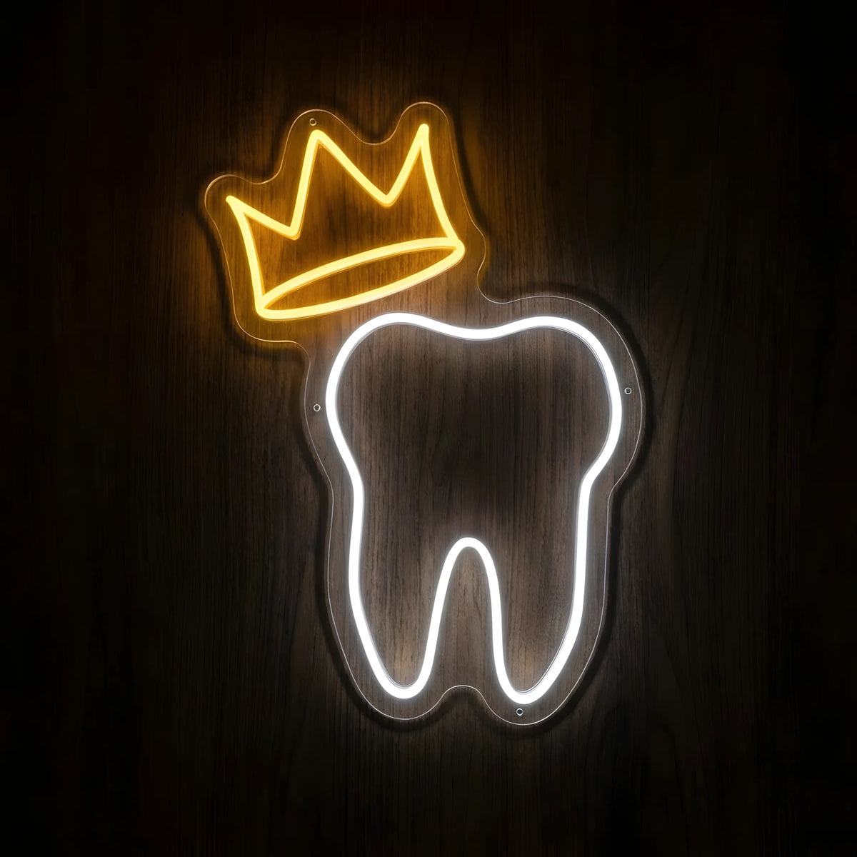 Royal Crown Tooth LED neon sign featuring a glowing white tooth outline topped with a golden-yellow crown on precision-cut clear acrylic backing against a dark wooden wall.