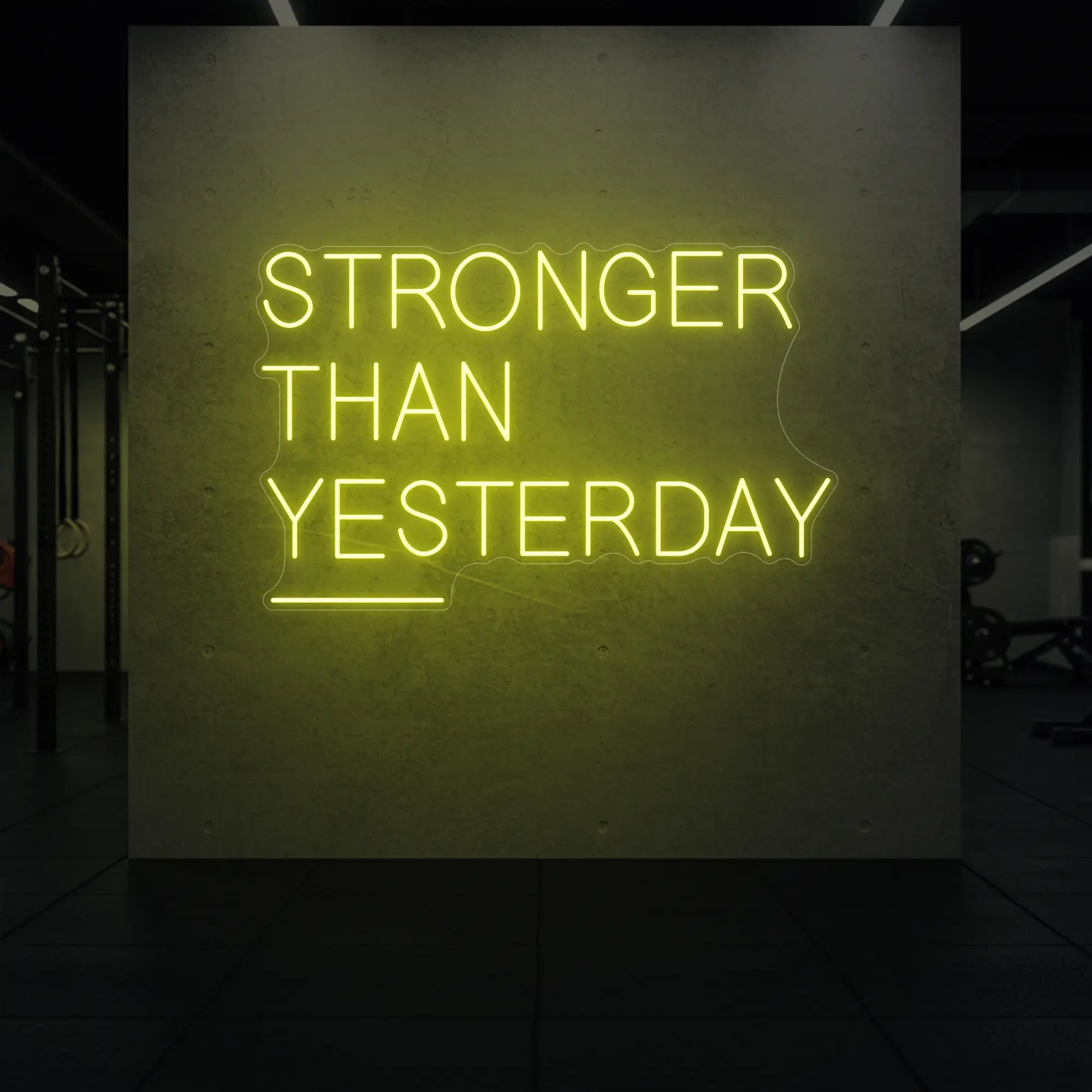 'Stronger Than Yesterday' neon sign glowing in lemon yellow against a styled interior wall.