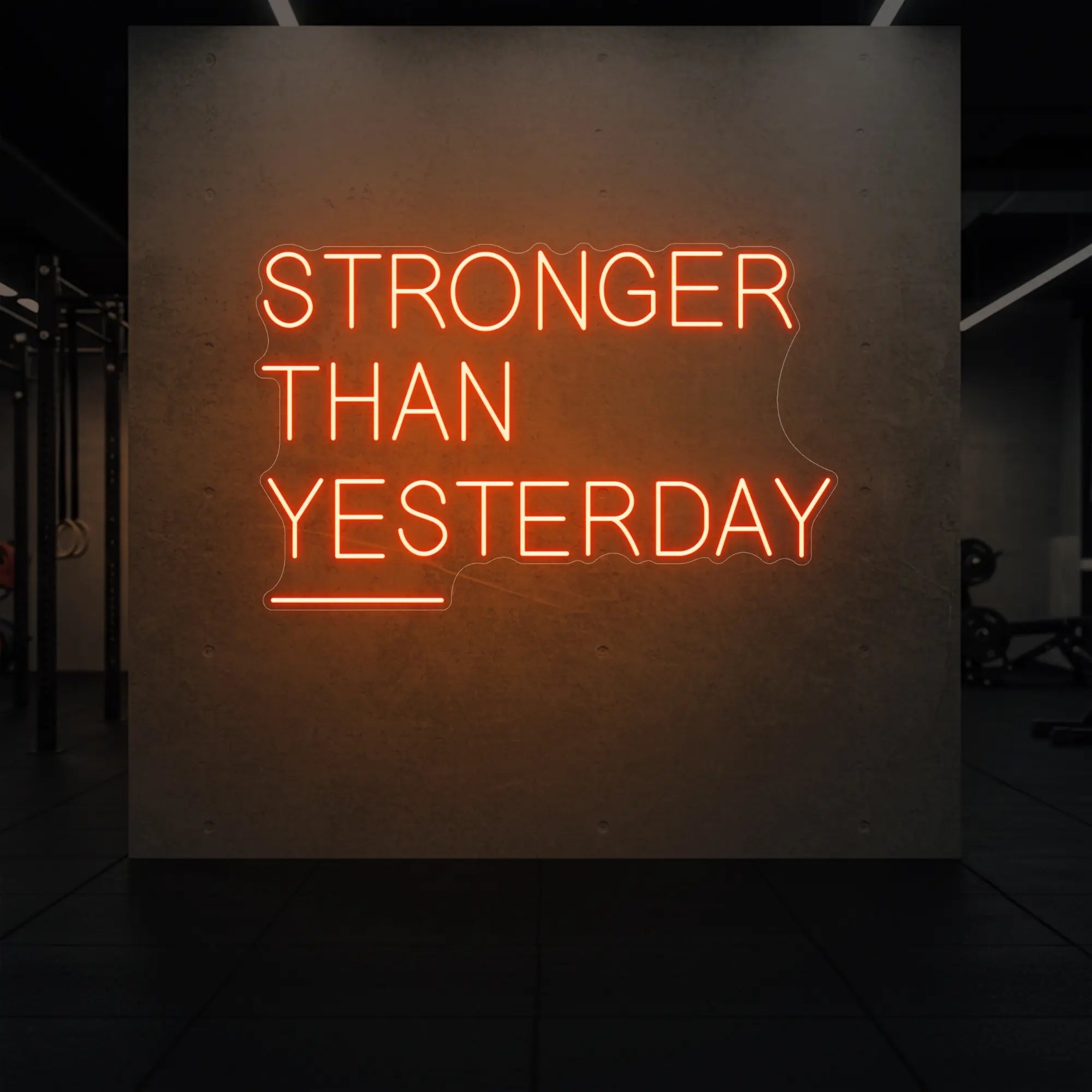 'Stronger Than Yesterday' neon sign glowing in golden yellow against a styled interior wall.