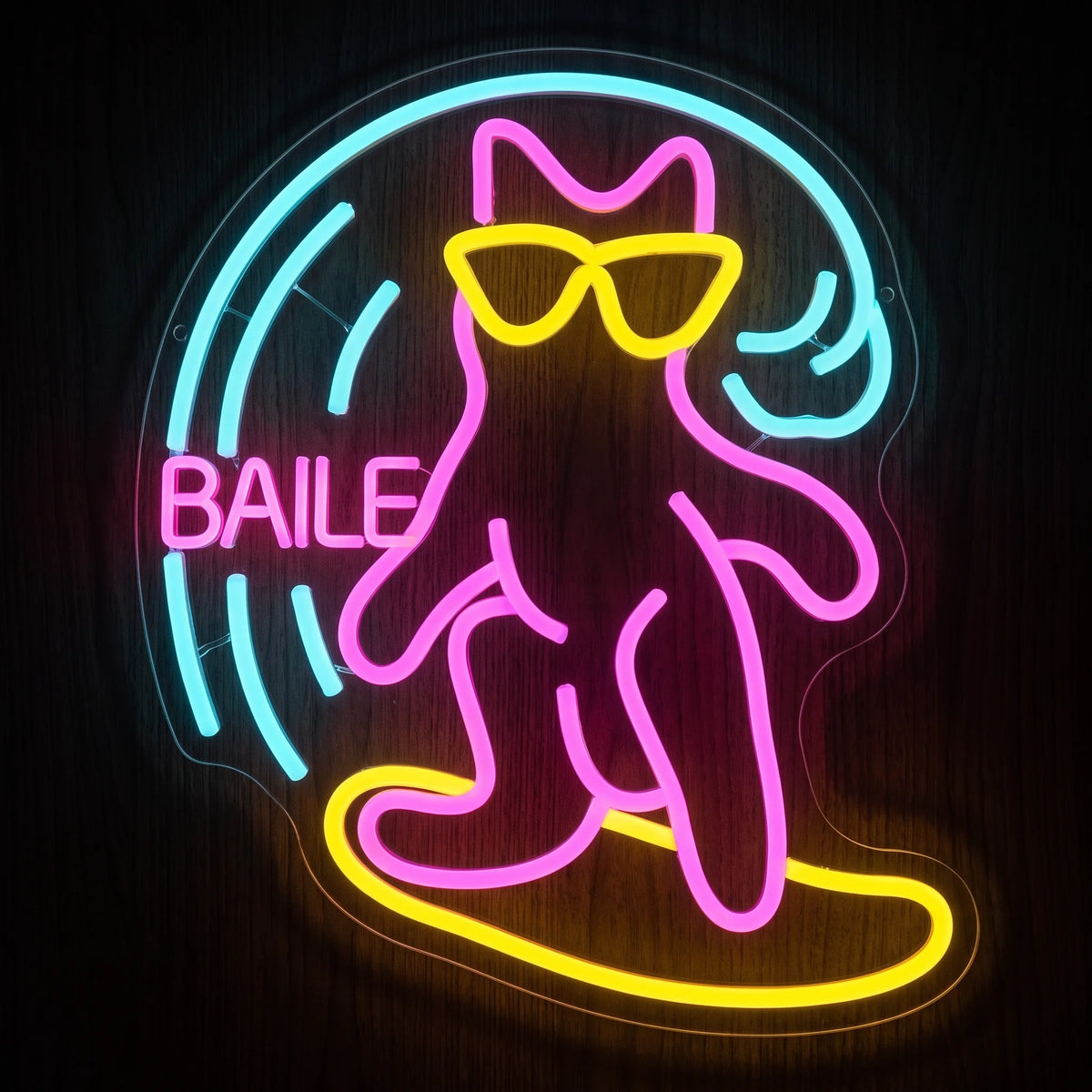 Surfing Cat LED Neon Sign featuring a pink cat with yellow sunglasses riding a yellow surfboard with blue wave details.
