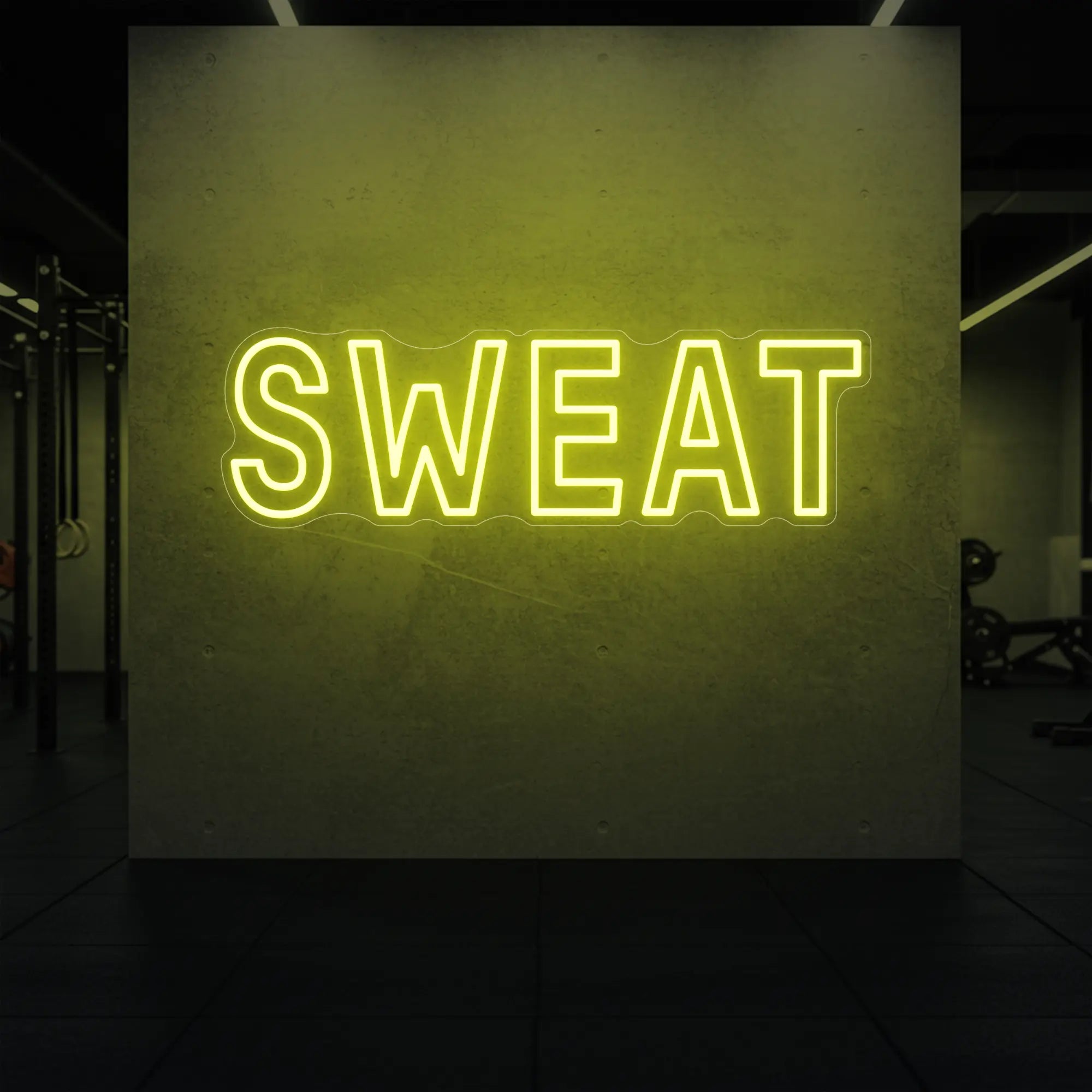 'SWEAT' neon sign glowing in lemon yellow against a styled interior wall.