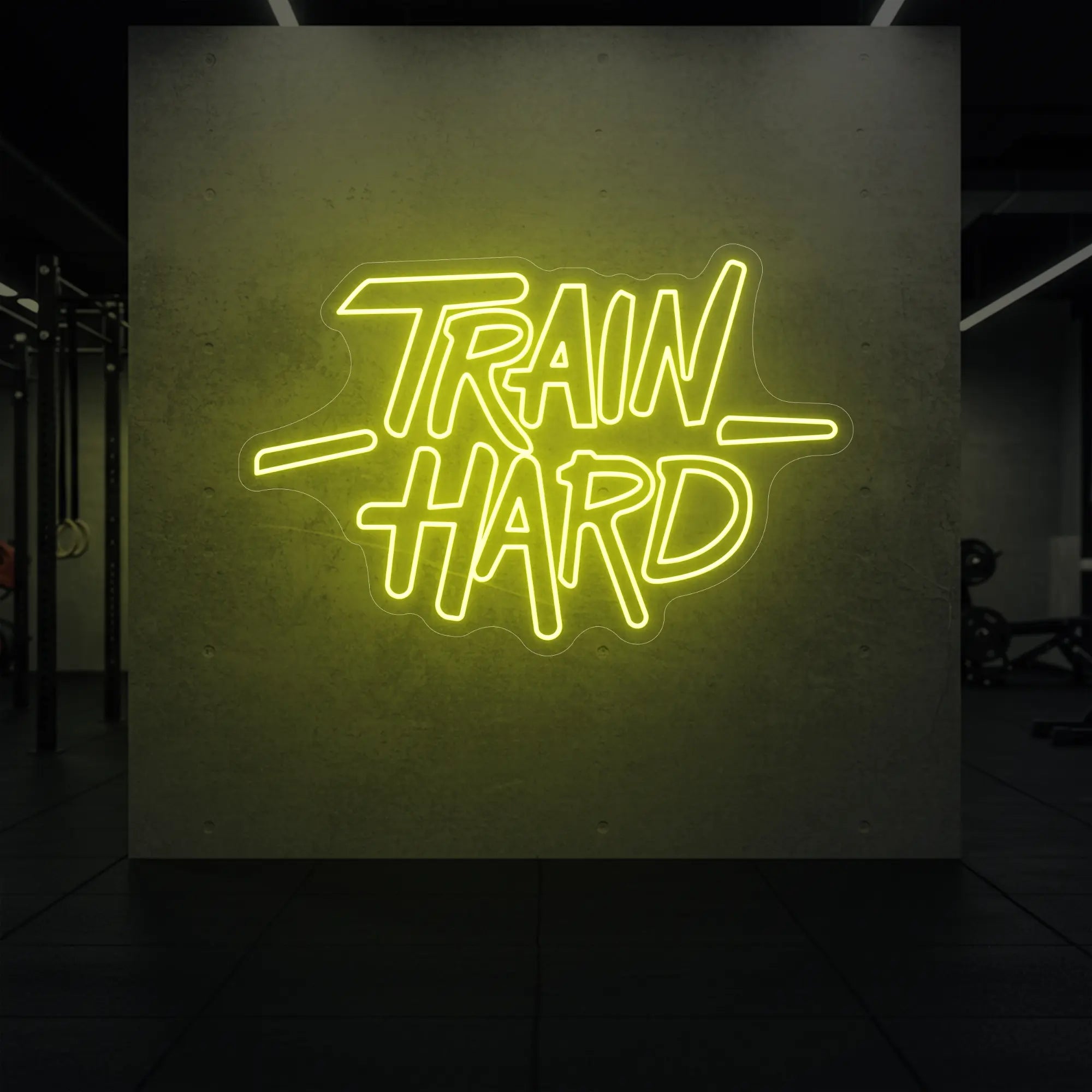 'TRAIN HARD' neon sign glowing in golden yellow against a styled interior wall.
