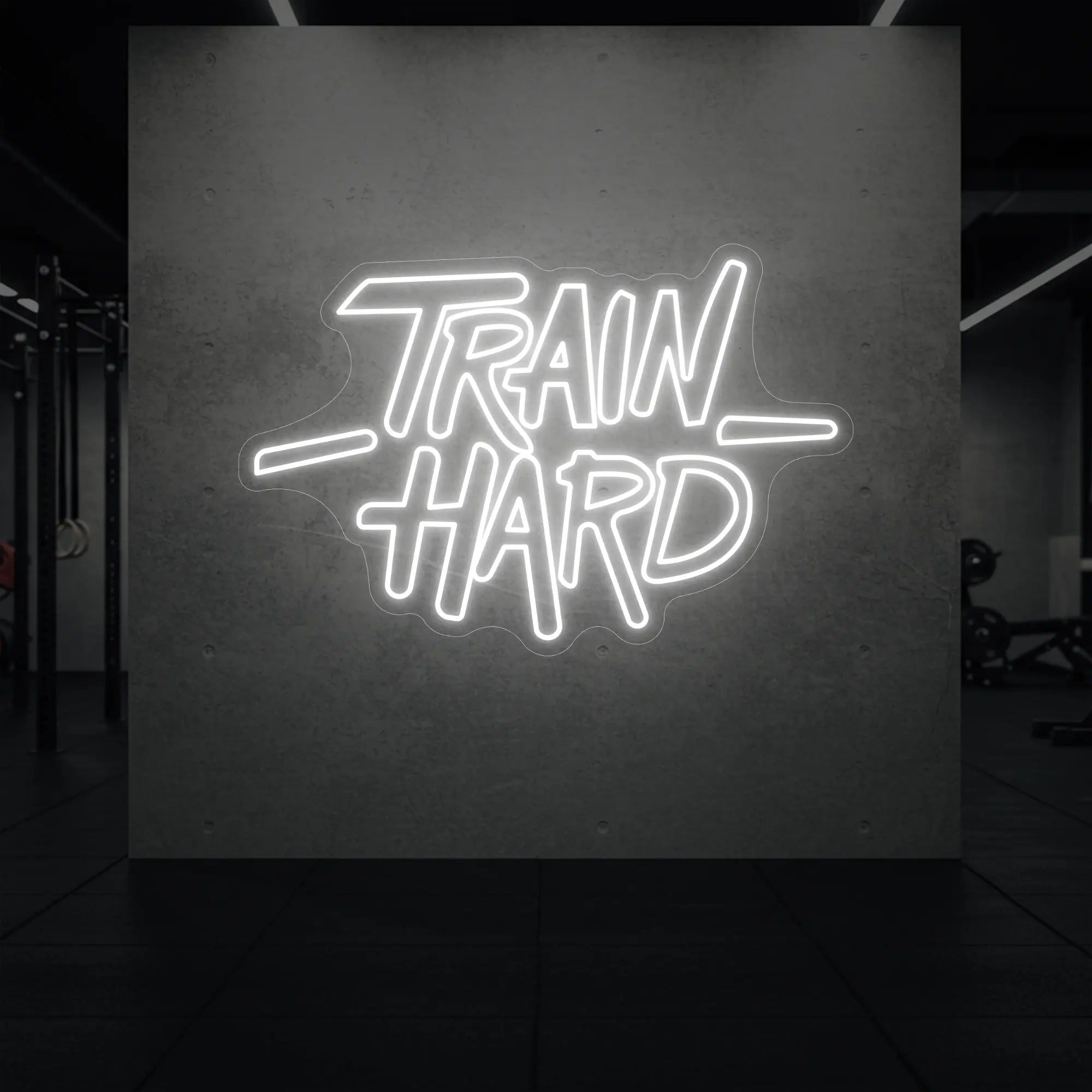 'TRAIN HARD' neon sign glowing in cool white against a styled interior wall.